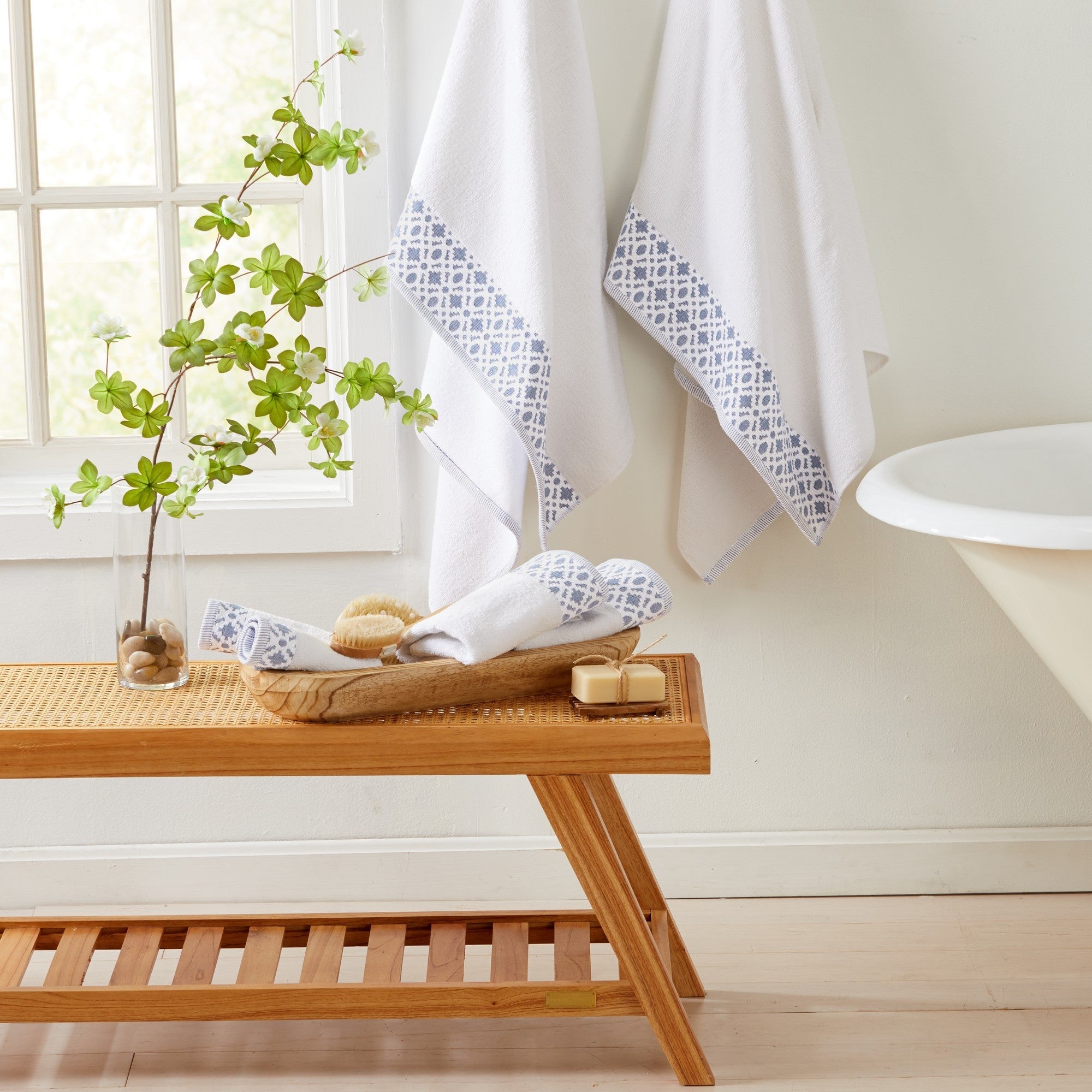 Nitra Collection Cotton Luxury Bath Towels by Market & Place featuring premium 100% cotton construction with an elegant geometric dobby border. Available in multiple colors and set configurations, including bath towels, hand towels, and washcloths, shown folded and stacked to highlight their soft, plush, and absorbent texture.