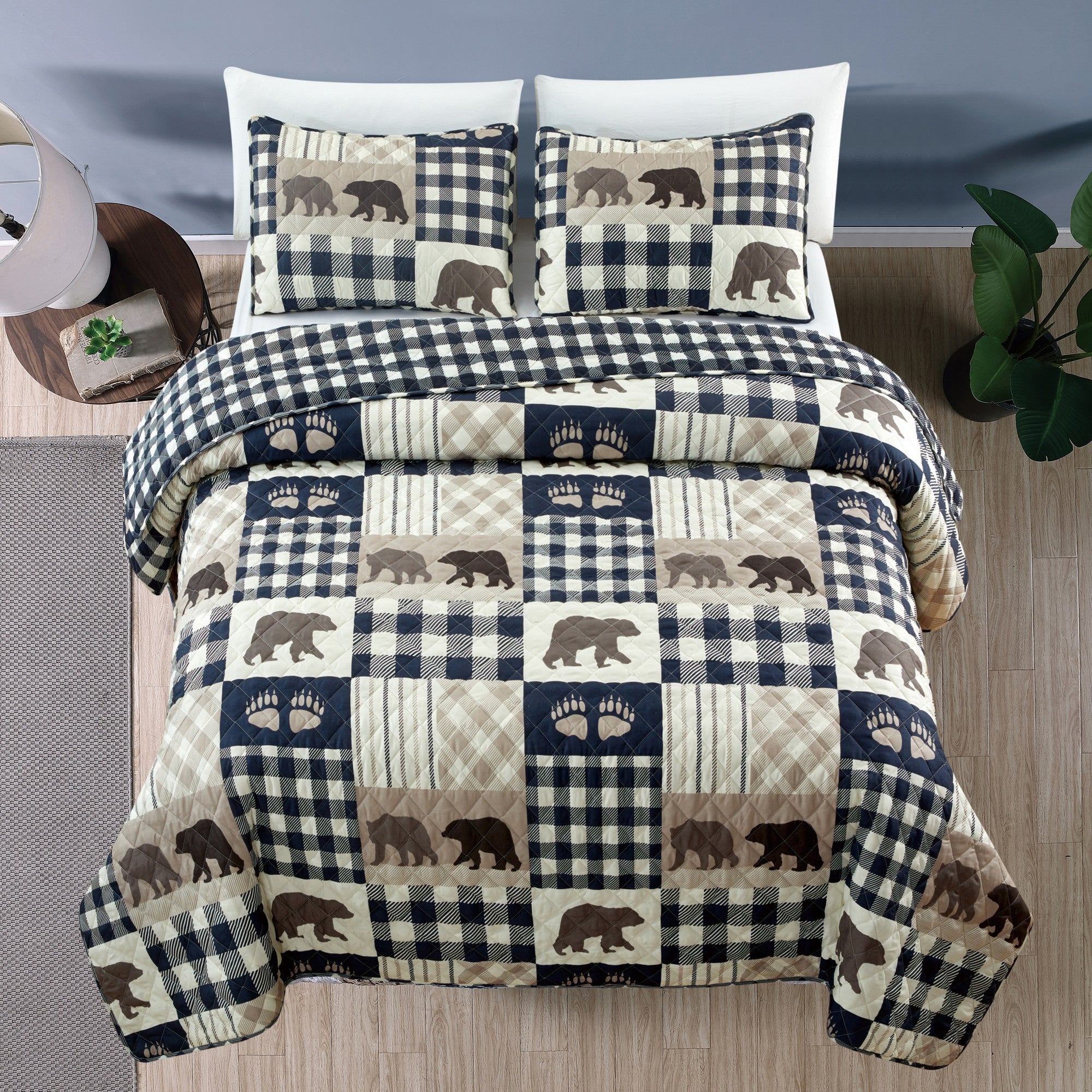 Orson Collection Lodge Quilt Set by Market & Place featuring soft microfiber construction and rustic lodge-inspired patchwork designs with plaid patterns and wildlife motifs. Coordinating shams and detailed fabric close-ups are shown in cozy bedroom settings, highlighting the reversible design and year-round comfort.