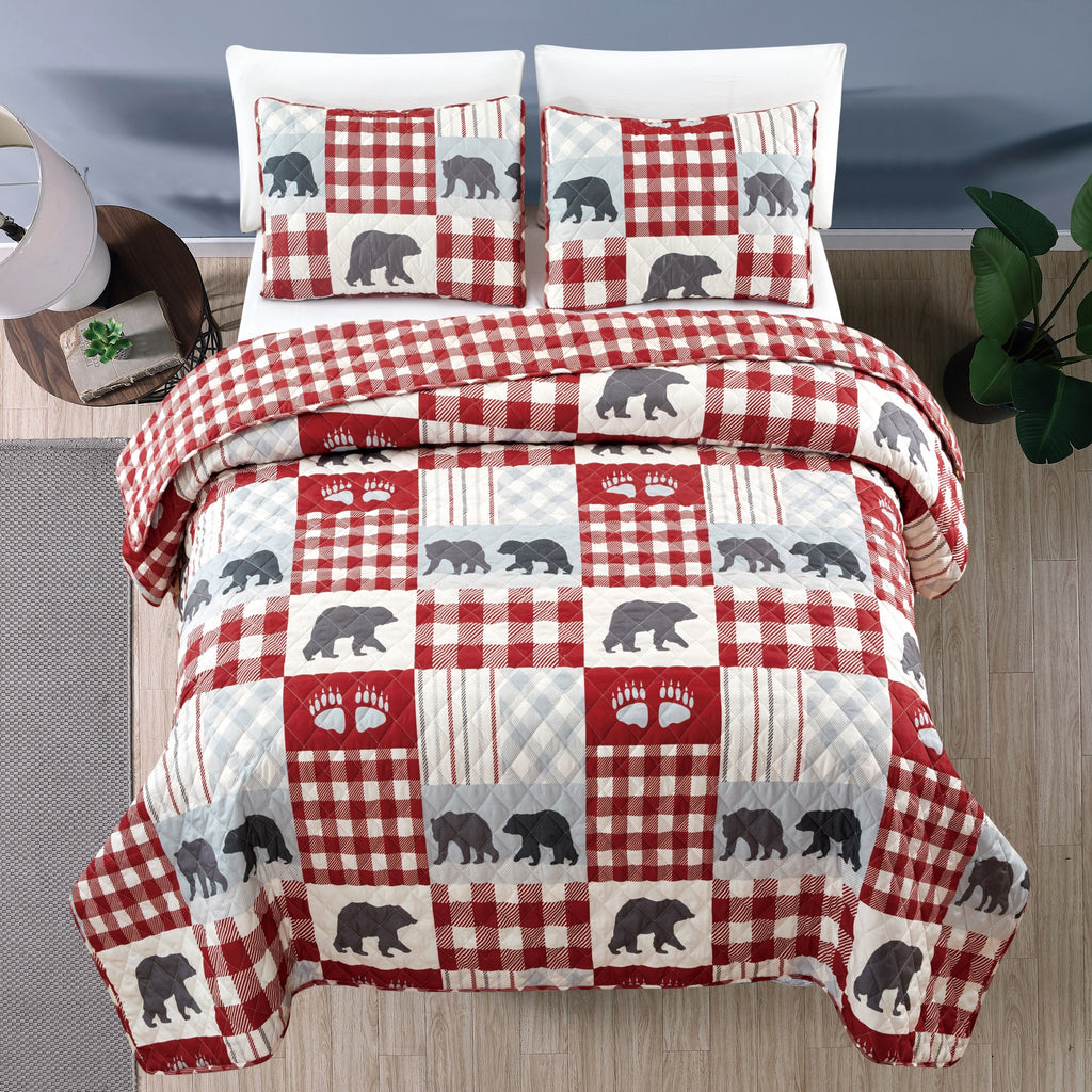 Orson Collection Lodge Quilt Set by Market & Place featuring soft microfiber construction and rustic lodge-inspired patchwork designs with plaid patterns and wildlife motifs. Coordinating shams and detailed fabric close-ups are shown in cozy bedroom settings, highlighting the reversible design and year-round comfort.