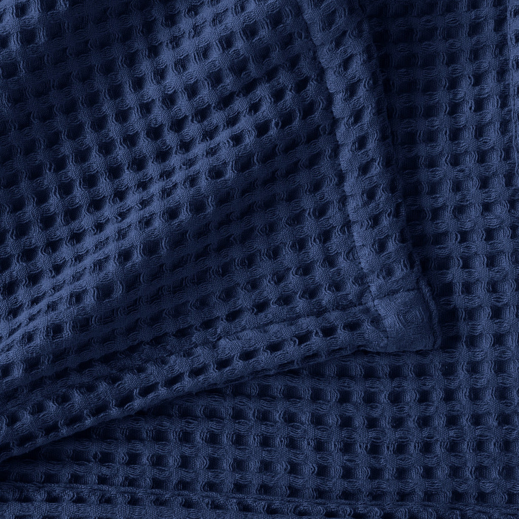 Brielle Collection Cotton Waffle Blanket by Market & Place featuring soft, breathable 100% cotton construction with a classic waffle weave texture. Available in multiple colors and shown folded, layered on beds, and in detailed fabric close-ups, highlighting its lightweight comfort and versatile year-round style.