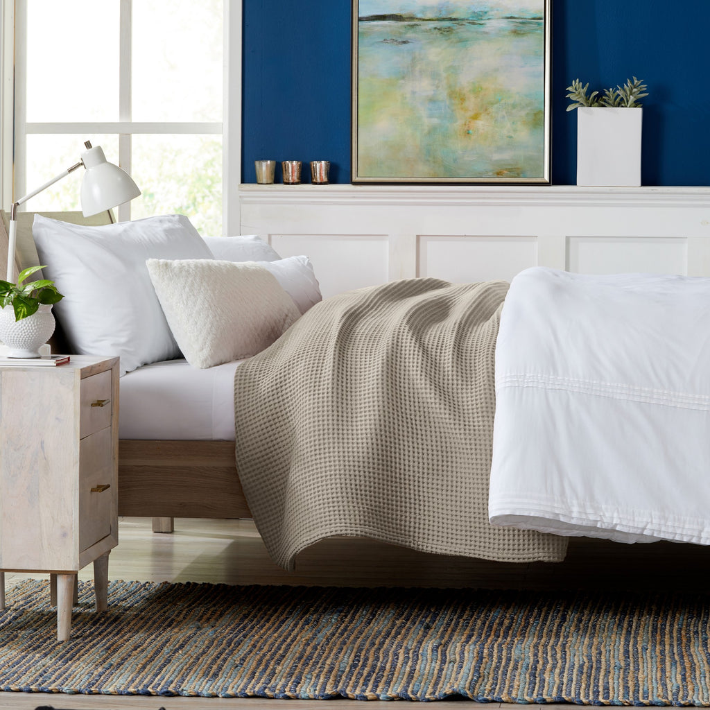 Brielle Collection Cotton Waffle Blanket by Market & Place featuring soft, breathable 100% cotton construction with a classic waffle weave texture. Available in multiple colors and shown folded, layered on beds, and in detailed fabric close-ups, highlighting its lightweight comfort and versatile year-round style.