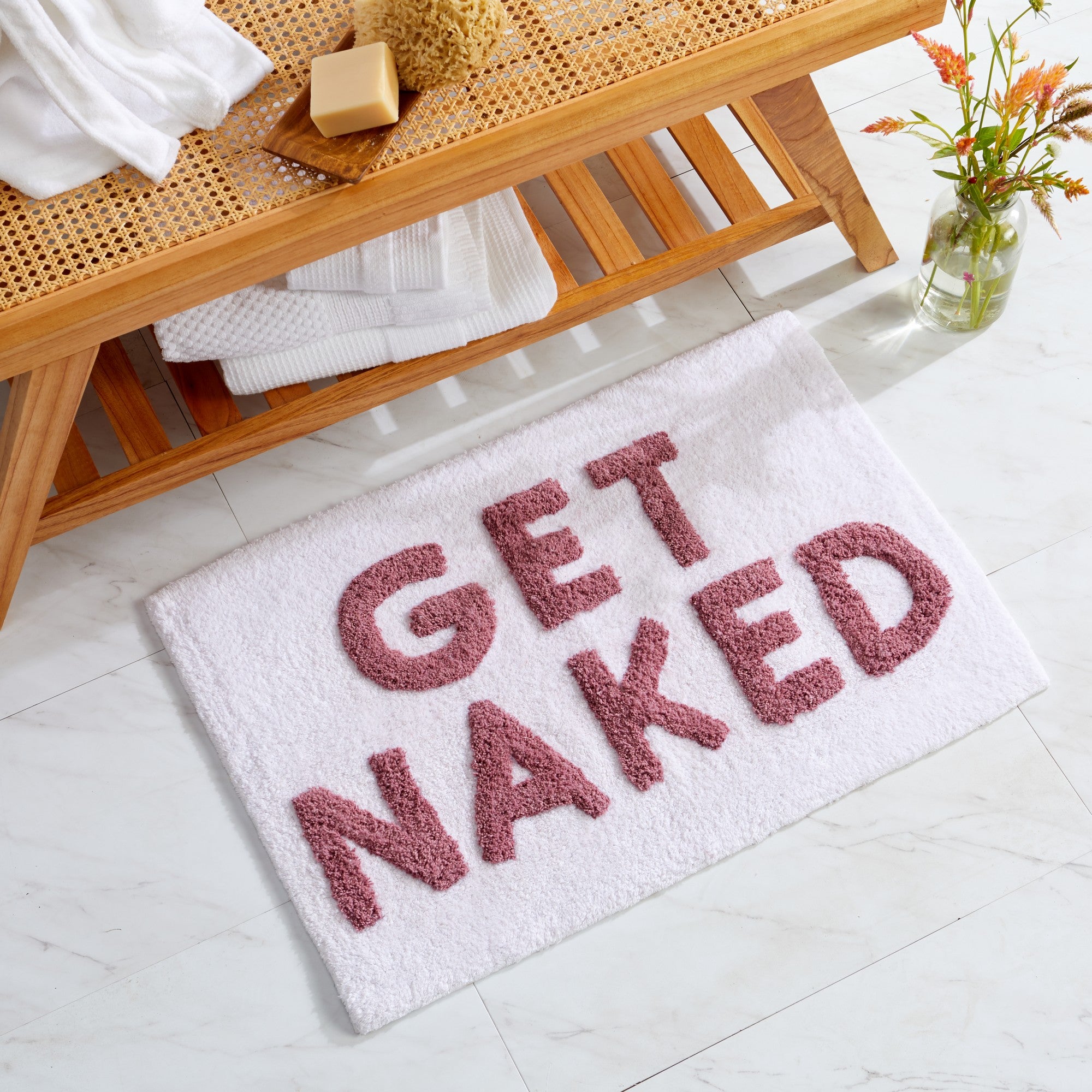 Plush tufted cotton bath rug featuring a fun decorative design with raised detailing. Soft, highly absorbent, and quick-drying, this 20 x 30 inch rug adds comfort and personality to any bathroom. Machine washable for easy care.