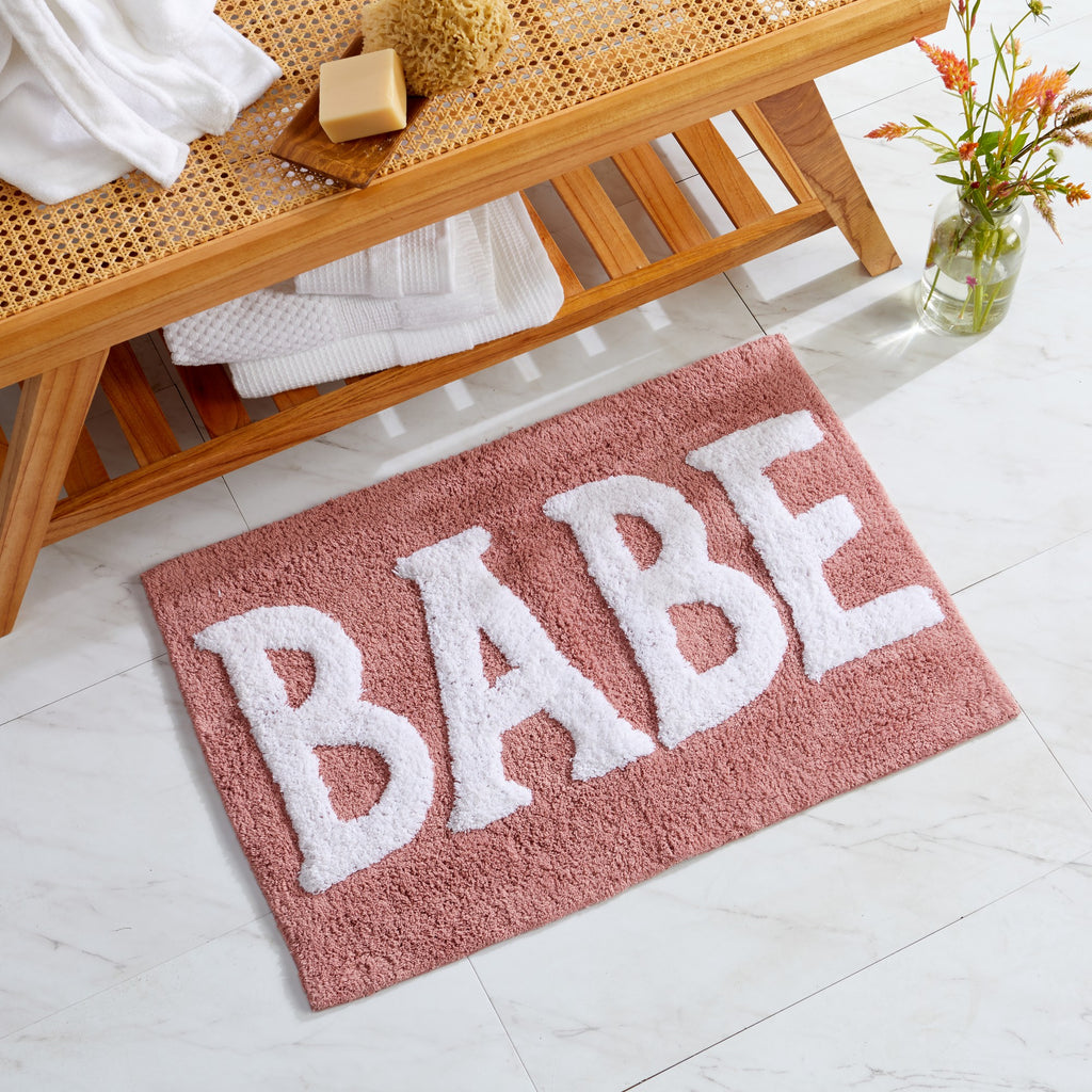 Plush tufted cotton bath rug featuring a fun decorative design with raised detailing. Soft, highly absorbent, and quick-drying, this 20 x 30 inch rug adds comfort and personality to any bathroom. Machine washable for easy care.
