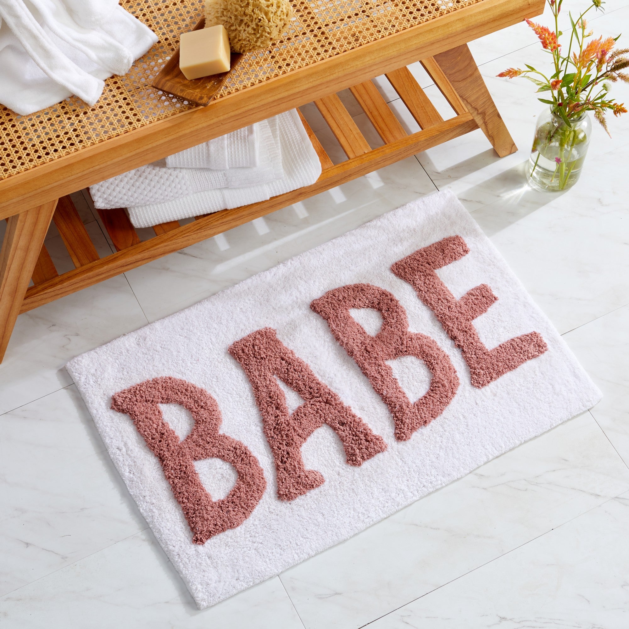 Plush tufted cotton bath rug featuring a fun decorative design with raised detailing. Soft, highly absorbent, and quick-drying, this 20 x 30 inch rug adds comfort and personality to any bathroom. Machine washable for easy care.