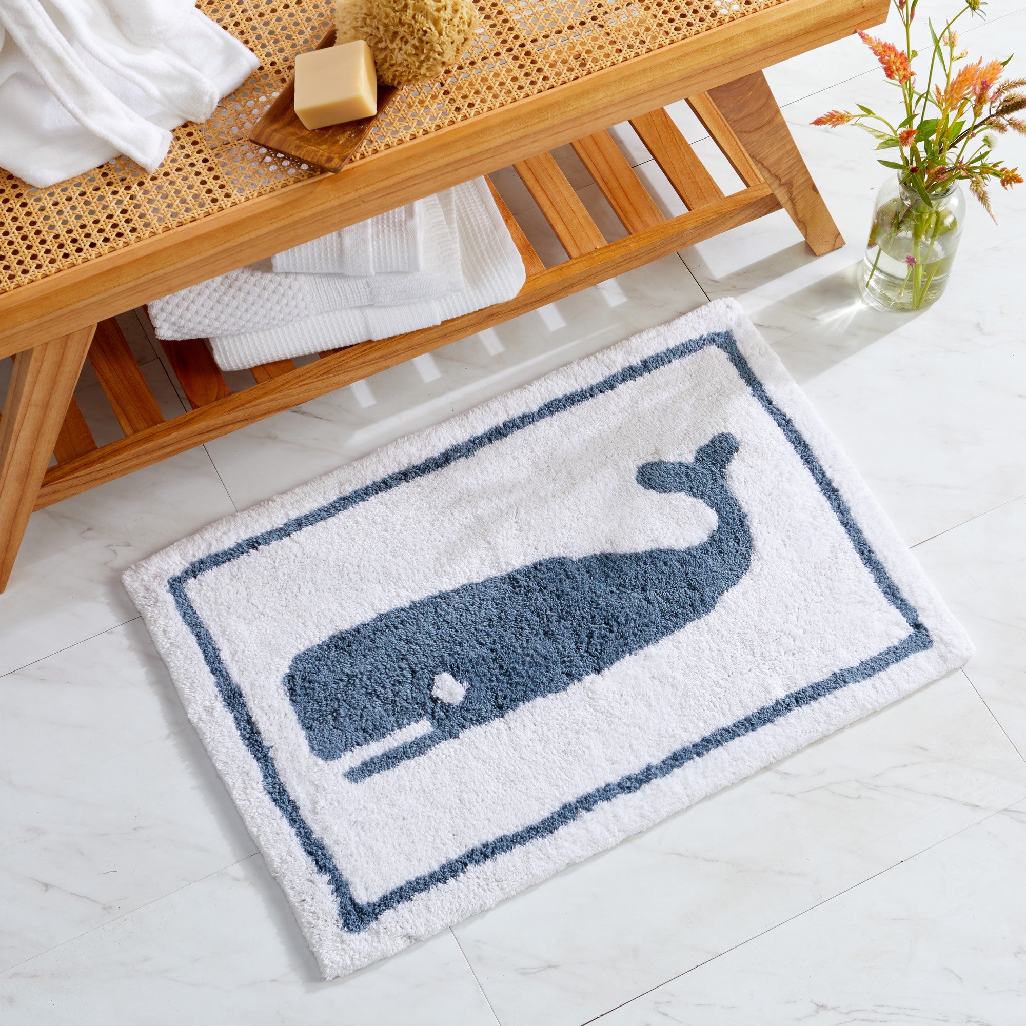 Plush tufted cotton bath rug featuring a fun decorative design with raised detailing. Soft, highly absorbent, and quick-drying, this 20 x 30 inch rug adds comfort and personality to any bathroom. Machine washable for easy care.