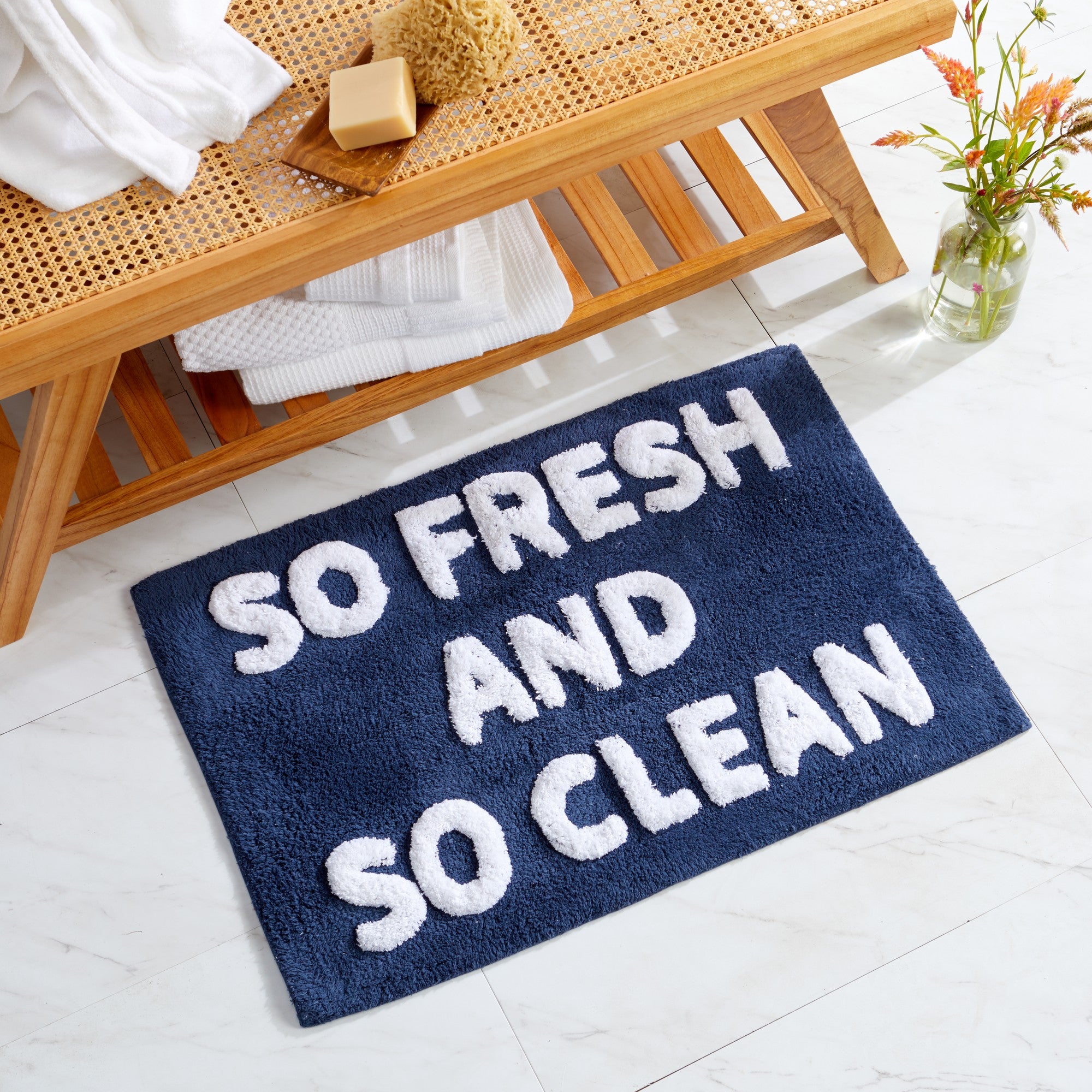 Plush tufted cotton bath rug featuring a fun decorative design with raised detailing. Soft, highly absorbent, and quick-drying, this 20 x 30 inch rug adds comfort and personality to any bathroom. Machine washable for easy care.