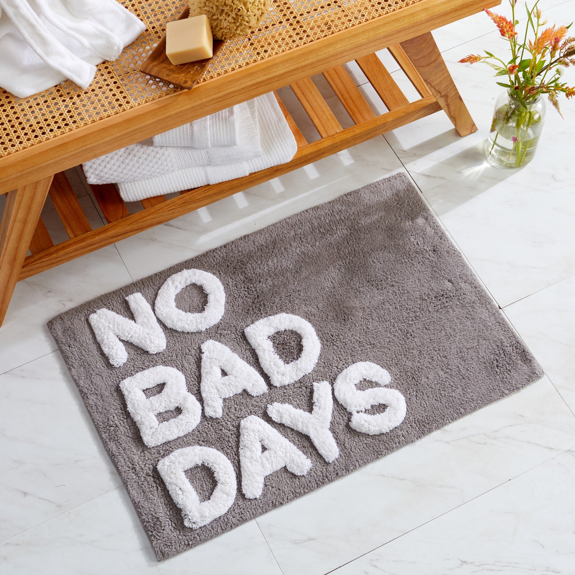 Plush tufted cotton bath rug featuring a fun decorative design with raised detailing. Soft, highly absorbent, and quick-drying, this 20 x 30 inch rug adds comfort and personality to any bathroom. Machine washable for easy care.