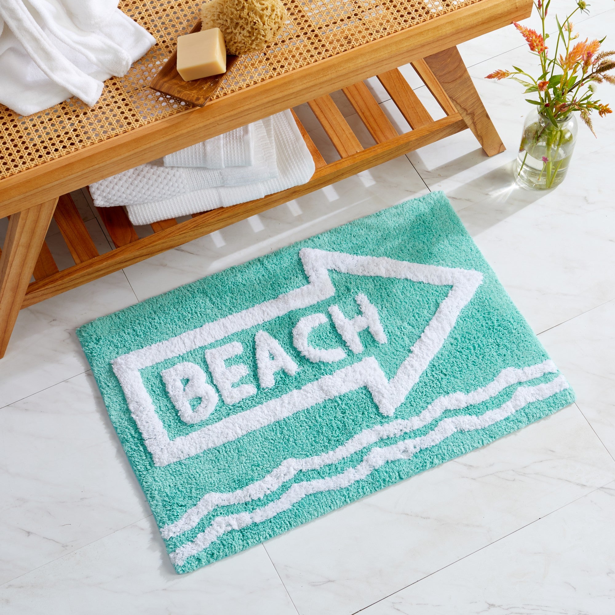 Plush tufted cotton bath rug featuring a fun decorative design with raised detailing. Soft, highly absorbent, and quick-drying, this 20 x 30 inch rug adds comfort and personality to any bathroom. Machine washable for easy care.