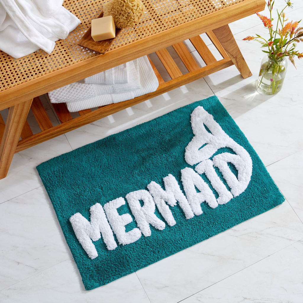 Plush tufted cotton bath rug featuring a fun decorative design with raised detailing. Soft, highly absorbent, and quick-drying, this 20 x 30 inch rug adds comfort and personality to any bathroom. Machine washable for easy care.
