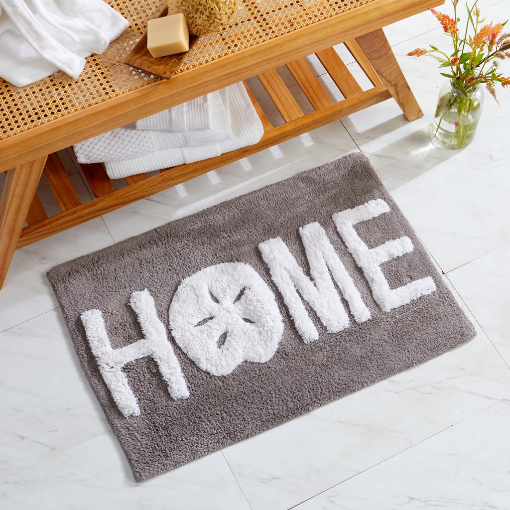 Plush tufted cotton bath rug featuring a fun decorative design with raised detailing. Soft, highly absorbent, and quick-drying, this 20 x 30 inch rug adds comfort and personality to any bathroom. Machine washable for easy care.