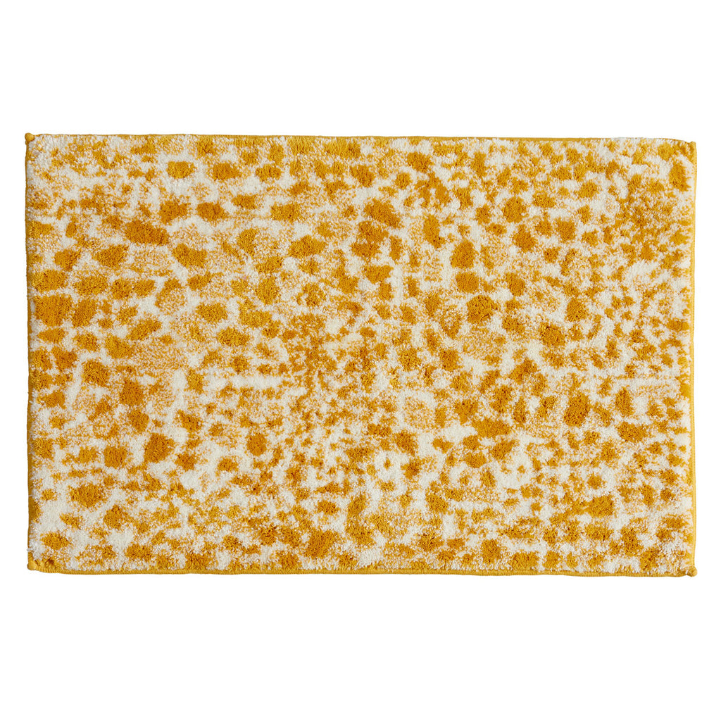 Rectangular bath rug featuring a bold cheetah-inspired pattern in mustard yellow and ivory. The plush, textured design adds a vibrant animal-print accent to modern and eclectic bathroom décor while providing soft, absorbent comfort underfoot.