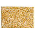 Rectangular bath rug featuring a bold cheetah-inspired pattern in mustard yellow and ivory. The plush, textured design adds a vibrant animal-print accent to modern and eclectic bathroom décor while providing soft, absorbent comfort underfoot.
