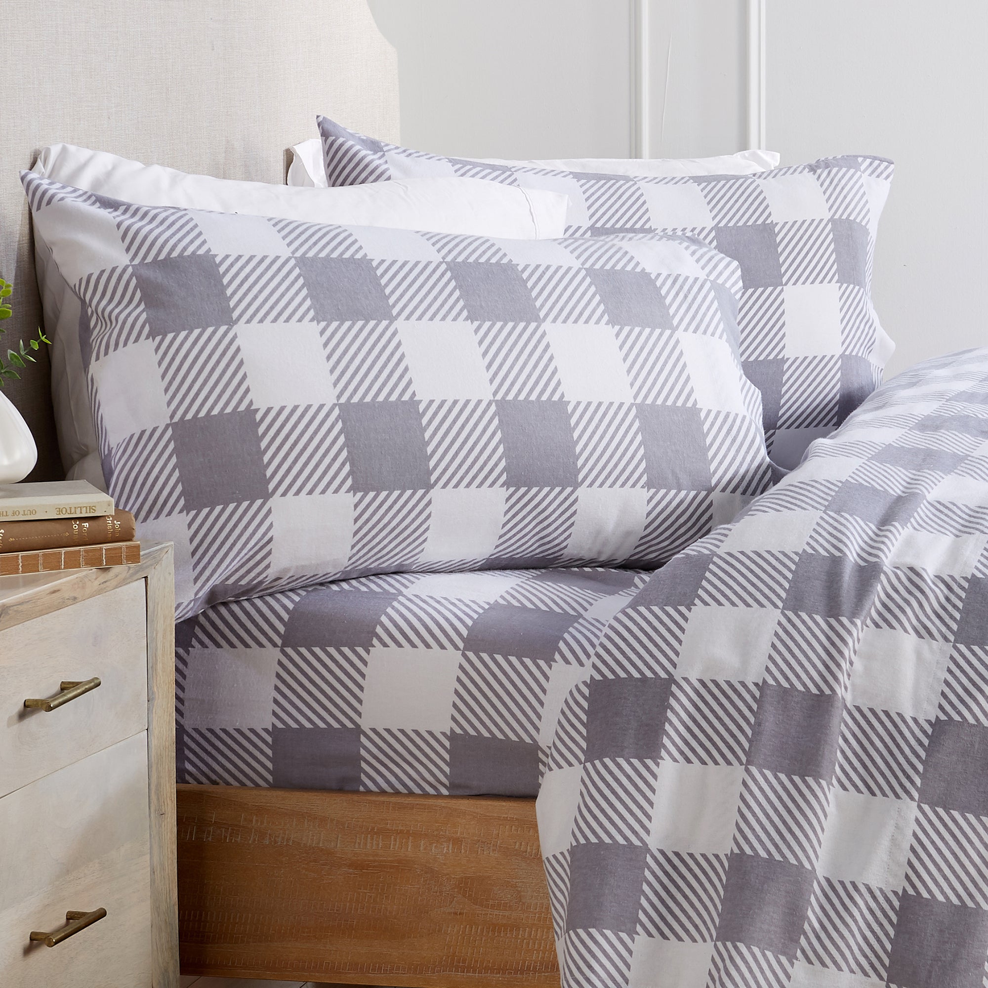 Printed 100% Turkish cotton flannel sheet set featuring assorted winter-inspired patterns, including woodland animals, snowflakes, trees, plaids, and seasonal motifs. Soft, cozy bedding shown in styled bedroom settings with close-up fabric details and folded sheet stacks in multiple designs.