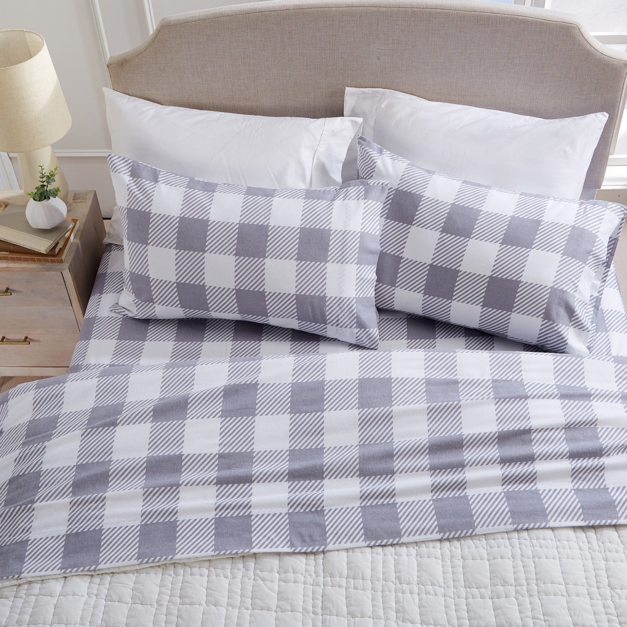 Printed 100% Turkish cotton flannel sheet set featuring assorted winter-inspired patterns, including woodland animals, snowflakes, trees, plaids, and seasonal motifs. Soft, cozy bedding shown in styled bedroom settings with close-up fabric details and folded sheet stacks in multiple designs.