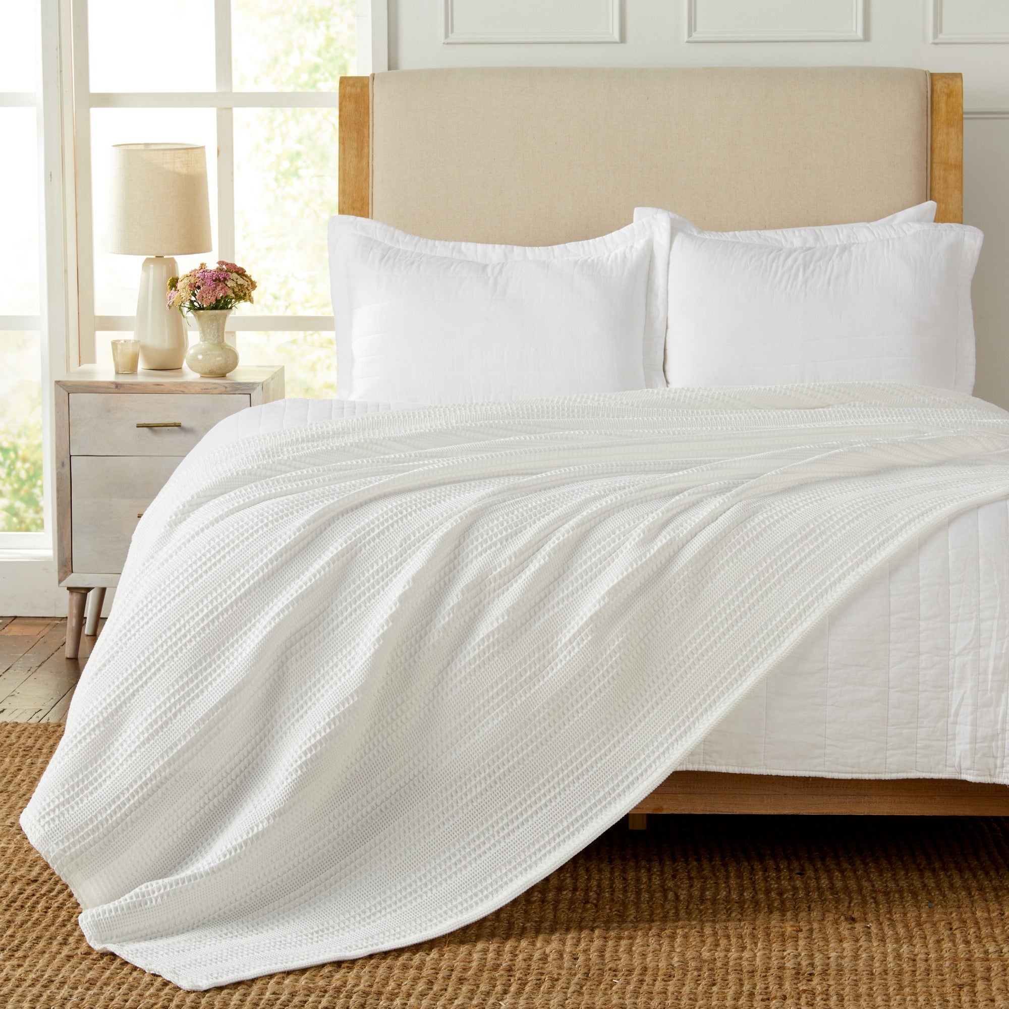 Soft and breathable 100% cotton waffle weave blanket, shown layered on a bed or folded for display. Lightweight and versatile, this textured blanket adds casual comfort and timeless style to any bedroom or living space. Available in Full/Queen and King sizes.