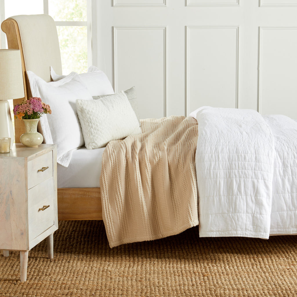 Soft and breathable 100% cotton waffle weave blanket, shown layered on a bed or folded for display. Lightweight and versatile, this textured blanket adds casual comfort and timeless style to any bedroom or living space. Available in Full/Queen and King sizes.