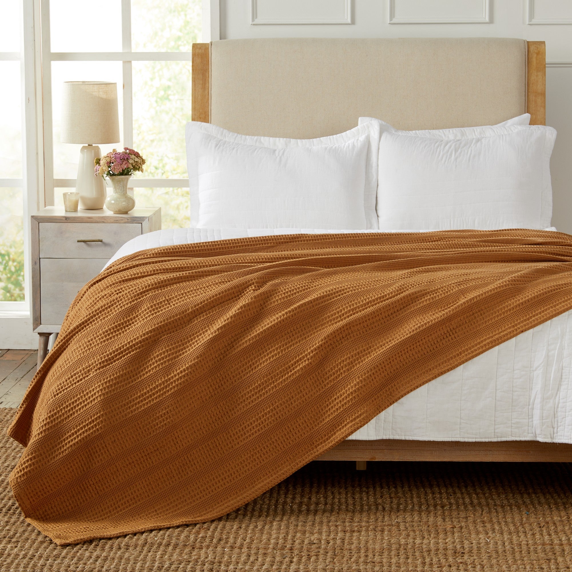 Soft and breathable 100% cotton waffle weave blanket, shown layered on a bed or folded for display. Lightweight and versatile, this textured blanket adds casual comfort and timeless style to any bedroom or living space. Available in Full/Queen and King sizes.
