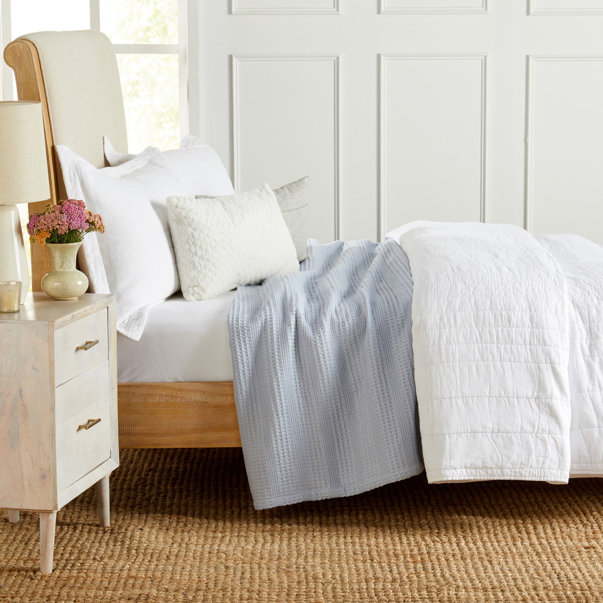 Soft and breathable 100% cotton waffle weave blanket, shown layered on a bed or folded for display. Lightweight and versatile, this textured blanket adds casual comfort and timeless style to any bedroom or living space. Available in Full/Queen and King sizes.