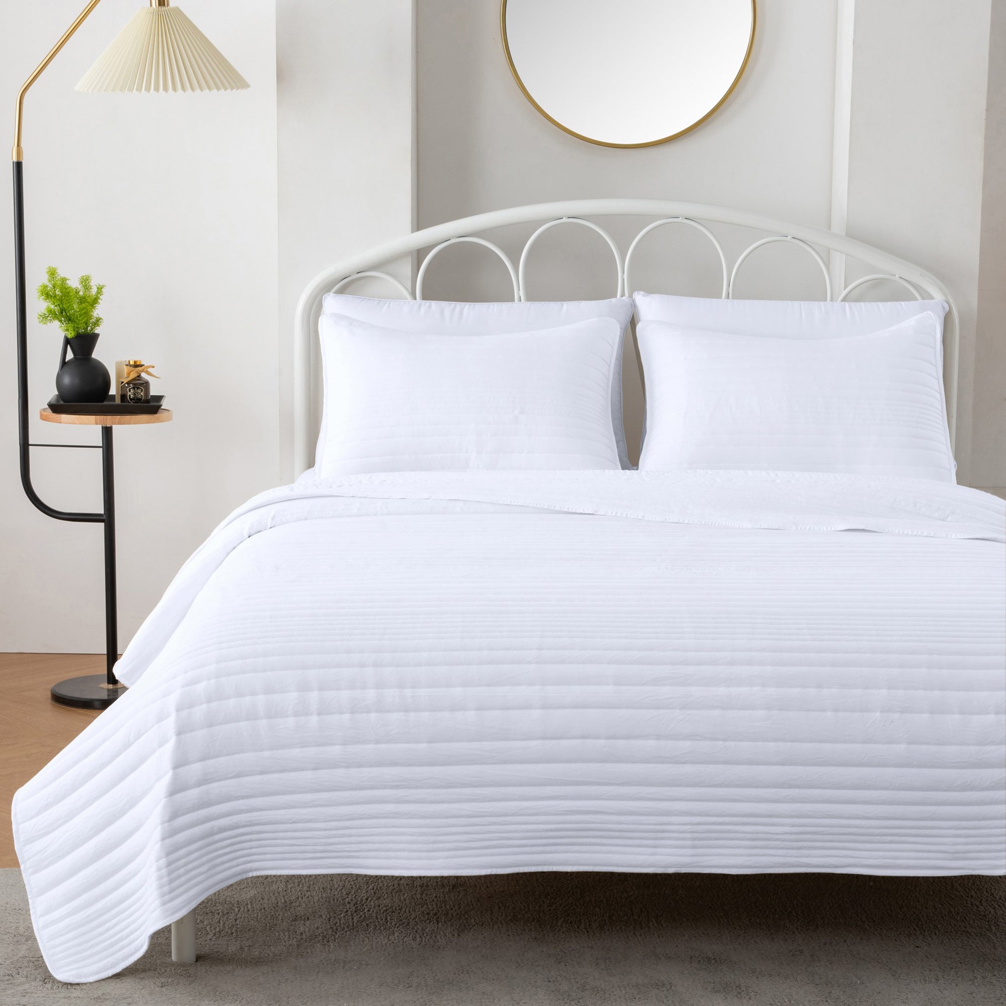 Parker Collection Solid Embroidered Quilt Set by Market & Place featuring soft microfiber construction and elegant channel embroidery. Available in multiple colors with coordinating shams and detailed fabric close-ups, styled in a modern bedroom setting.