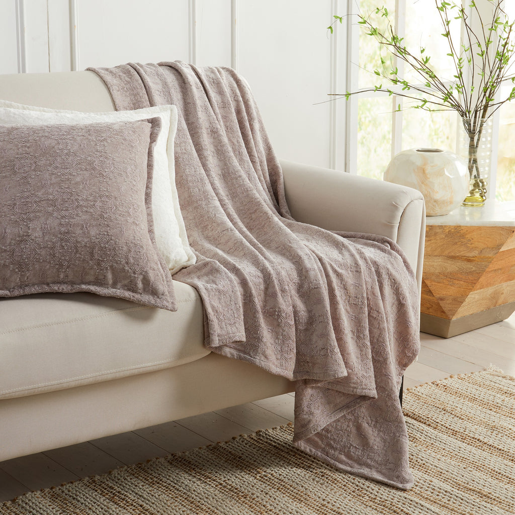 Grey Charlotte Collection Chenille Jacquard Throw Blanket draped over sofa with matching decorative pillow, soft textured chenille fabric for cozy living room décor.