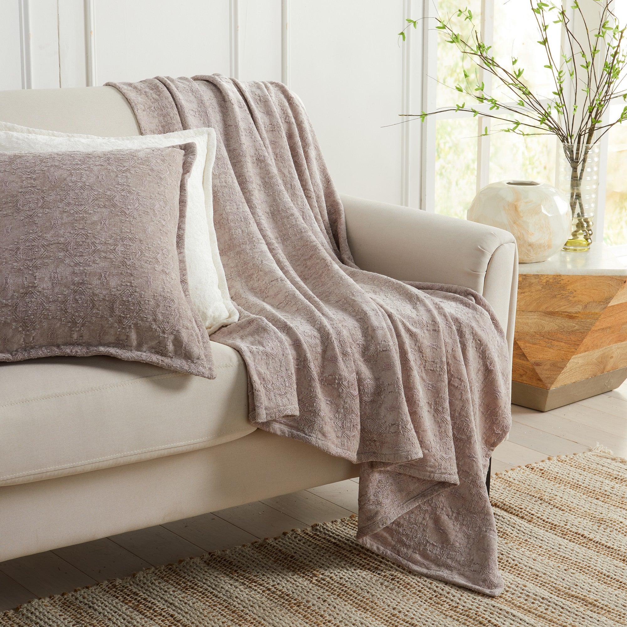 Grey Charlotte Collection Chenille Jacquard Throw Blanket draped over sofa with matching decorative pillow, soft textured chenille fabric for cozy living room décor.