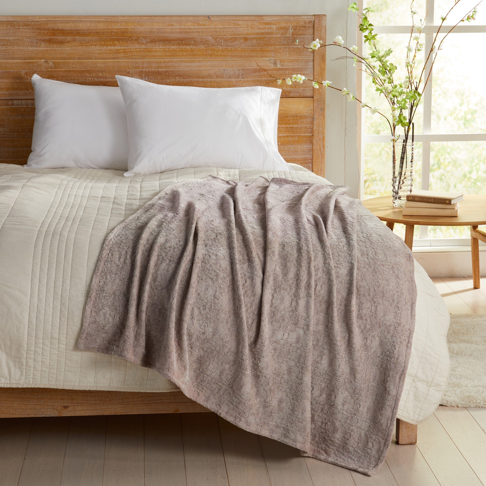 Grey Charlotte Collection Chenille Jacquard Throw Blanket draped across bed, soft textured chenille fabric adding warmth and comfort to farmhouse, contemporary, and modern bedroom décor.