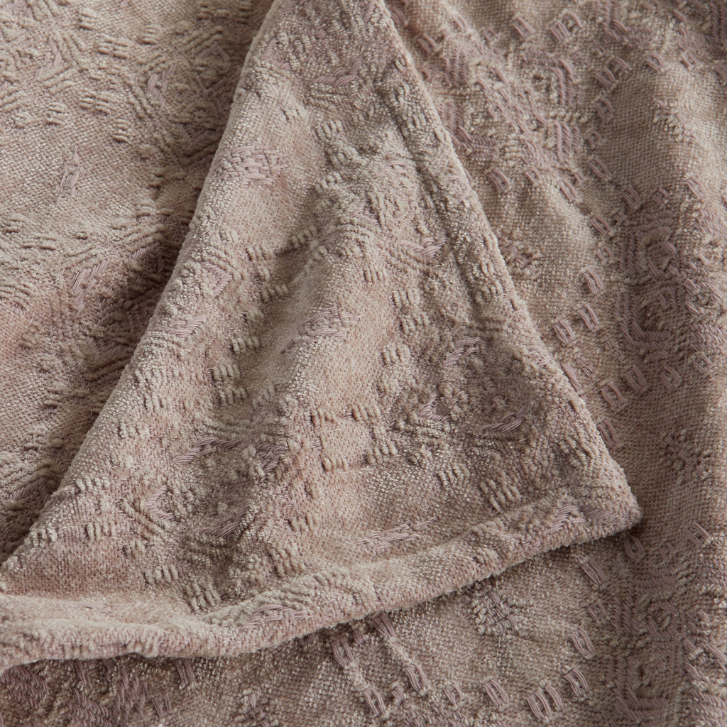 Close-up of the Grey Charlotte Collection Chenille Jacquard Throw Blanket highlighting its plush chenille texture, woven jacquard pattern, and decorative hem detail.
