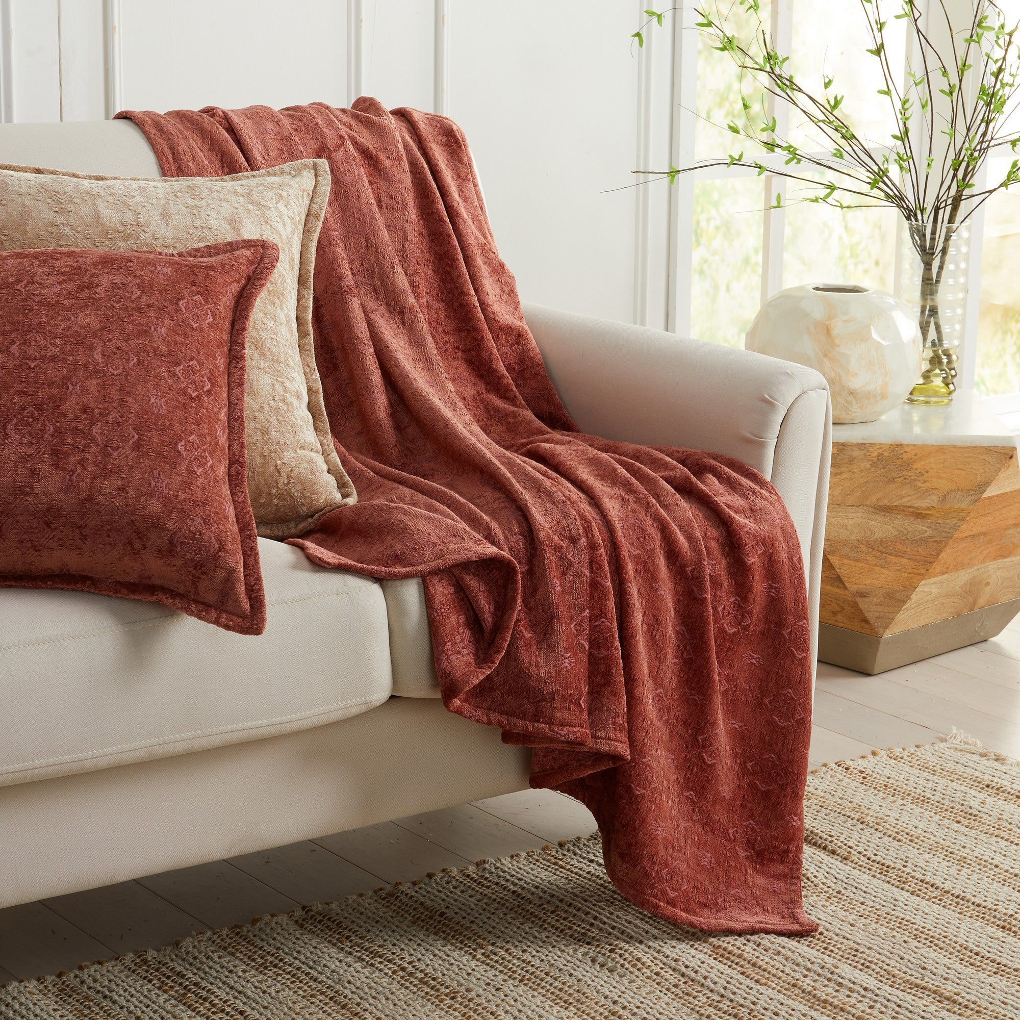 Rose Charlotte Collection Chenille Jacquard Throw Blanket draped over sofa with matching decorative pillow, soft textured chenille fabric for cozy farmhouse and modern home décor.