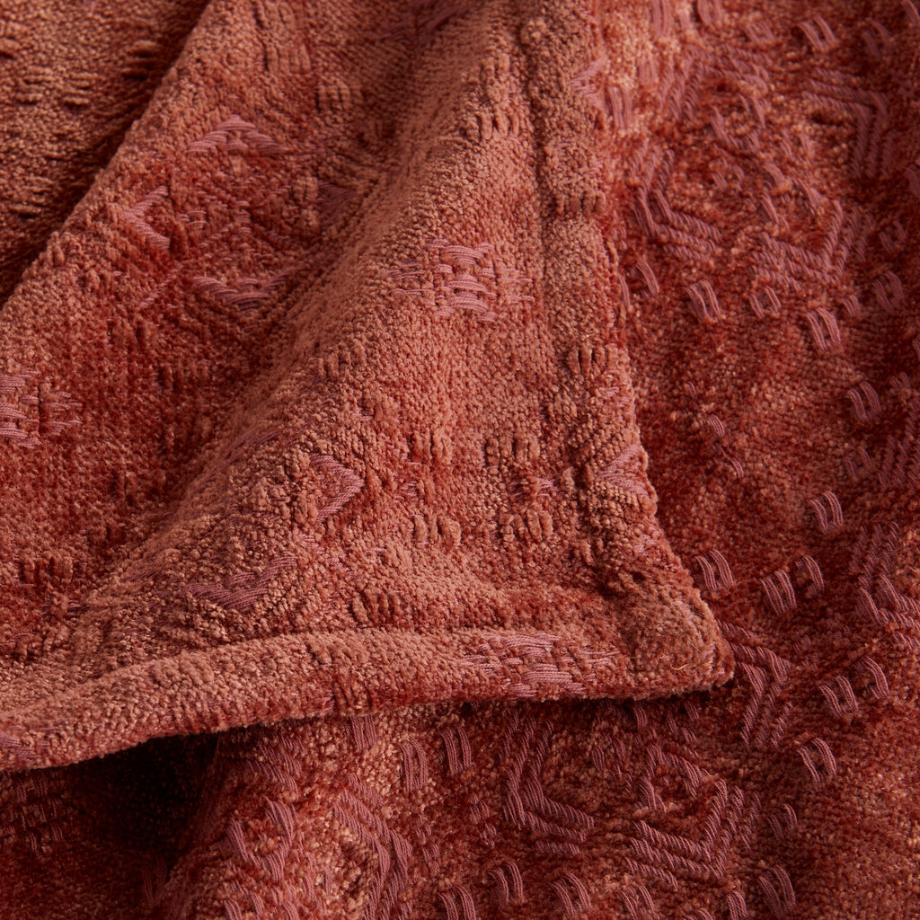 Close-up of the Rose Charlotte Collection Chenille Jacquard Throw Blanket featuring a soft chenille texture, intricate woven jacquard pattern, and decorative finished edge.