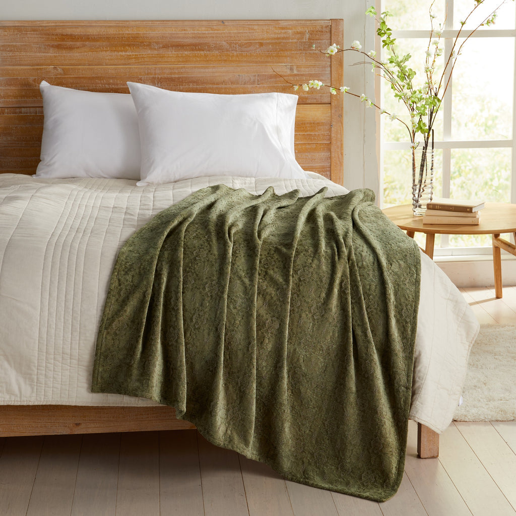 Sage Charlotte Collection Chenille Jacquard Throw Blanket draped across bed, soft textured chenille fabric adding warmth and comfort to farmhouse, rustic, and modern bedroom décor.