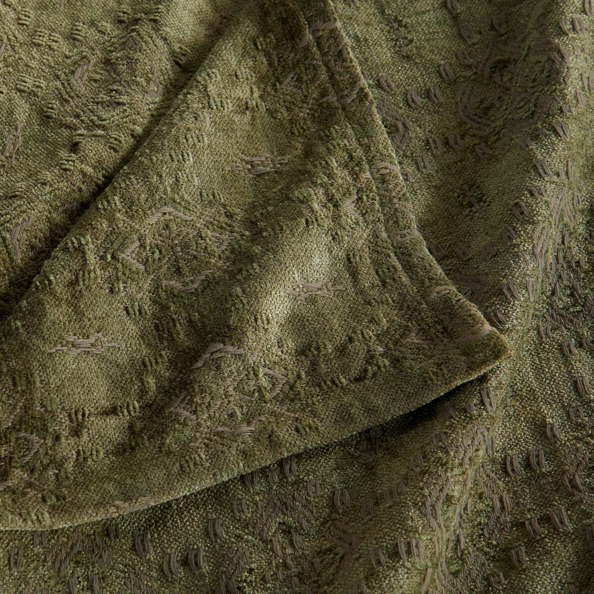 Close-up of the Sage Charlotte Collection Chenille Jacquard Throw Blanket highlighting its plush chenille texture, woven jacquard pattern, and decorative finished edge.