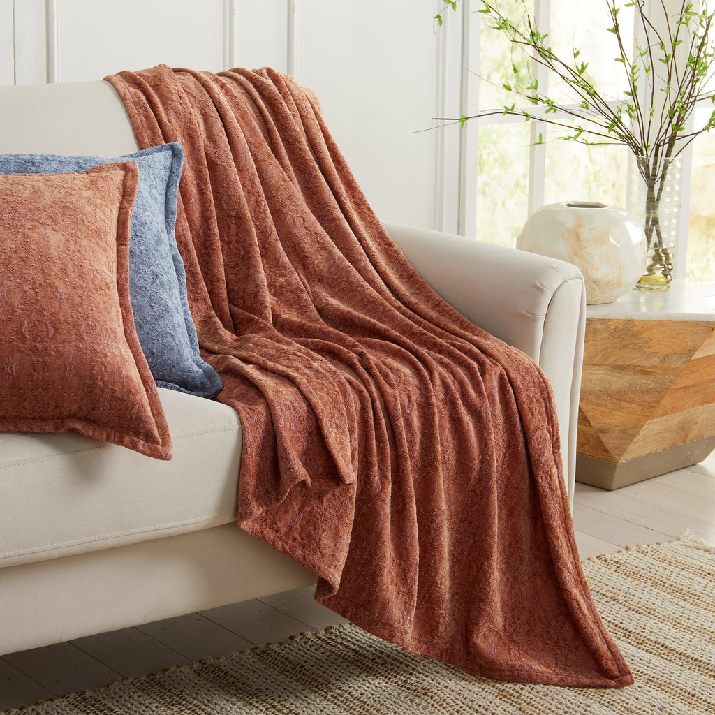 Clay Charlotte Collection Chenille Jacquard Throw Blanket draped over sofa with coordinating decorative pillows, soft textured chenille fabric for cozy farmhouse and modern living room décor.