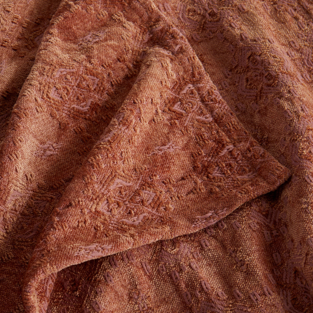 Close-up of the Clay Charlotte Collection Chenille Jacquard Throw Blanket showcasing its soft chenille texture, intricate woven jacquard pattern, and decorative finished edge.