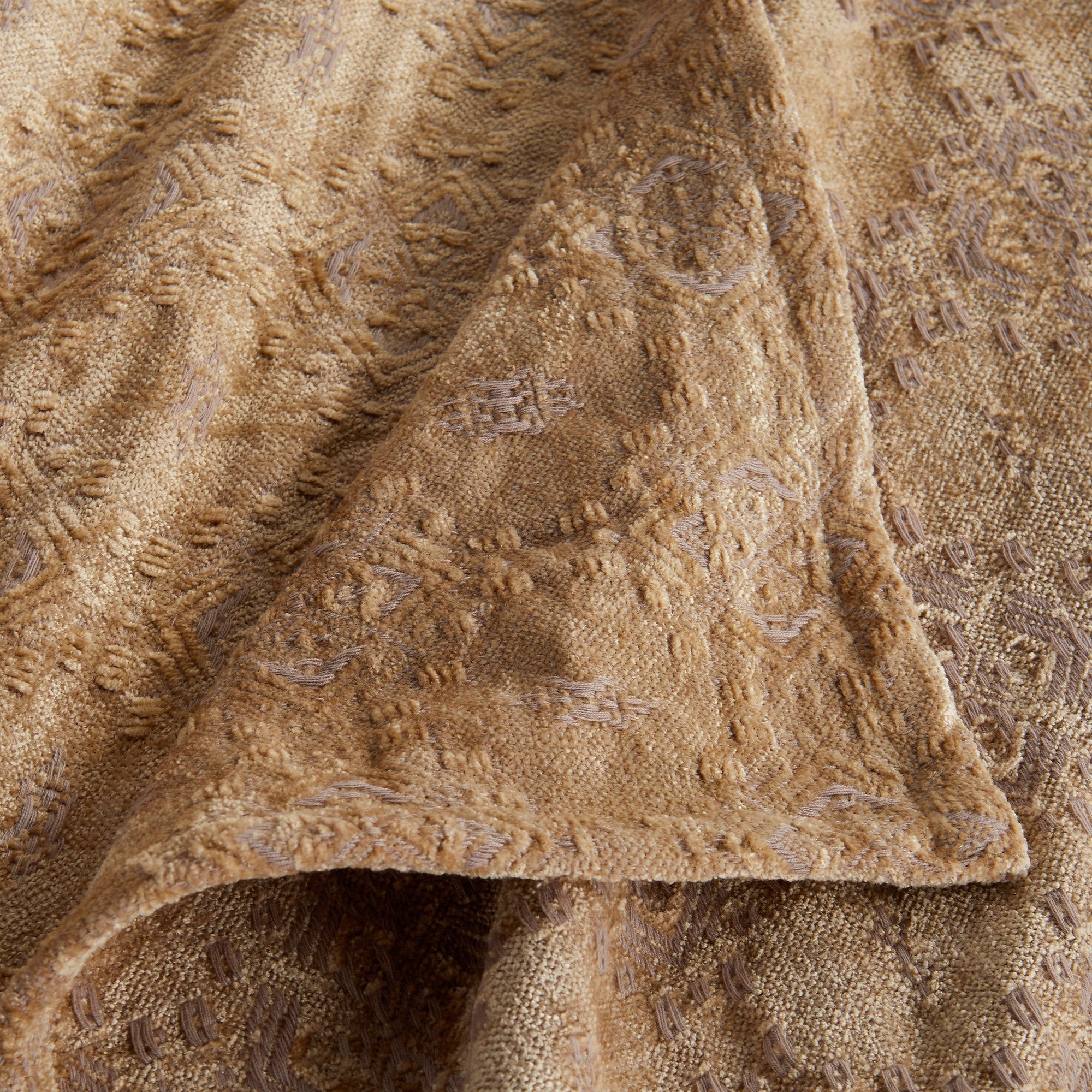 Close-up of the Beige Charlotte Collection Chenille Jacquard Throw Blanket featuring a plush chenille texture, detailed woven jacquard pattern, and decorative finished edge.