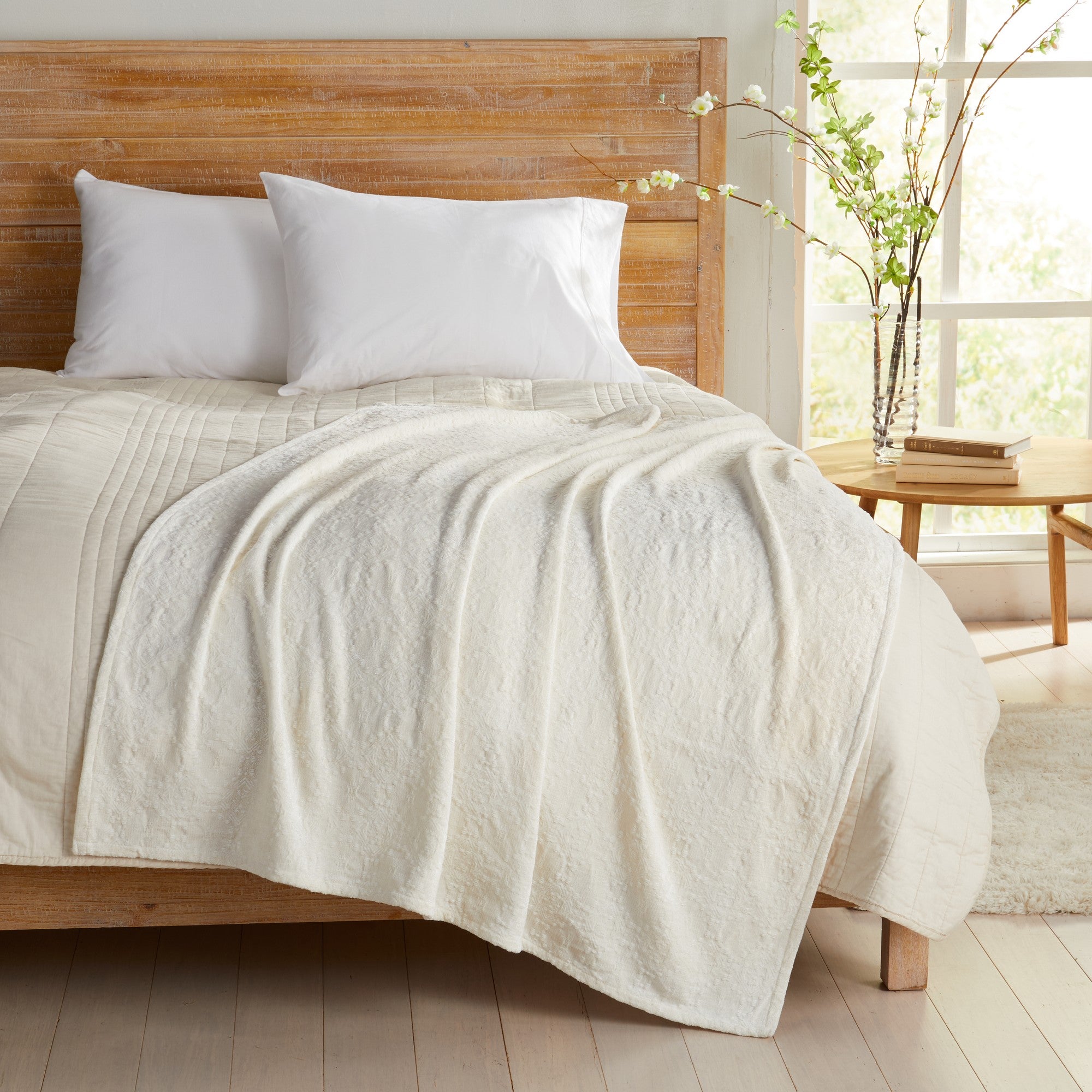 White Charlotte Collection Chenille Jacquard Throw Blanket draped across bed, featuring soft textured chenille fabric and a lightweight design that complements farmhouse, coastal, and contemporary bedroom décor.