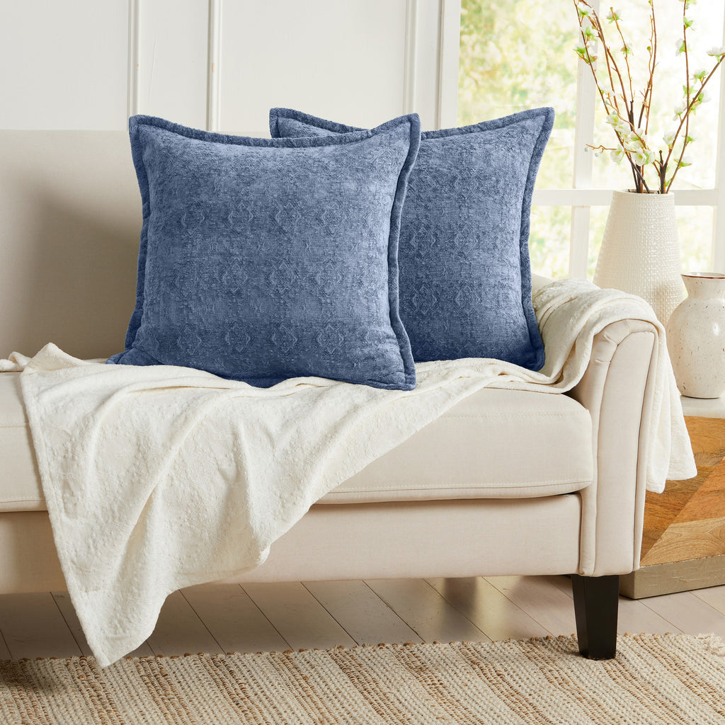 Blue chenille jacquard decorative pillow covers set of 2 displayed on an accent chair, 20x20 textured throw pillow covers for living room decor