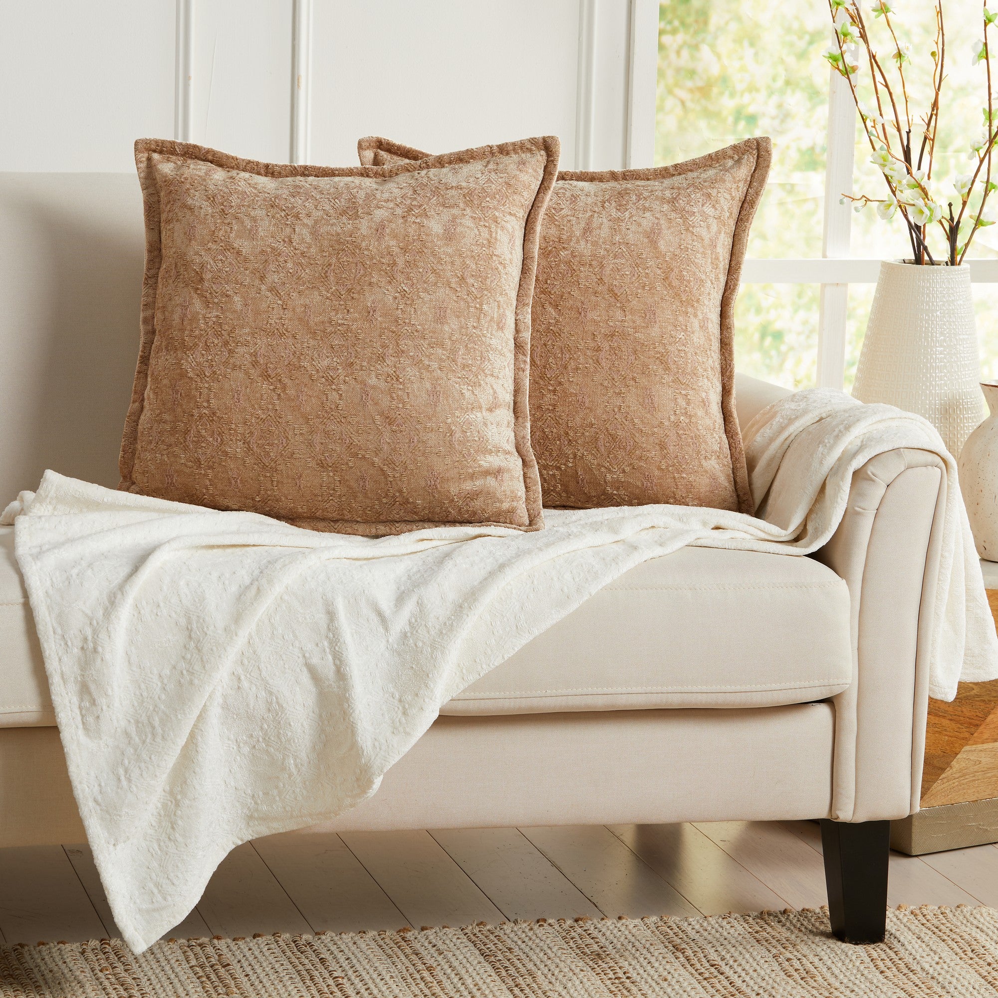 Beige chenille jacquard decorative pillow covers set of 2 on an accent chair, soft textured throw pillow covers for living room, bedroom, and farmhouse home decor