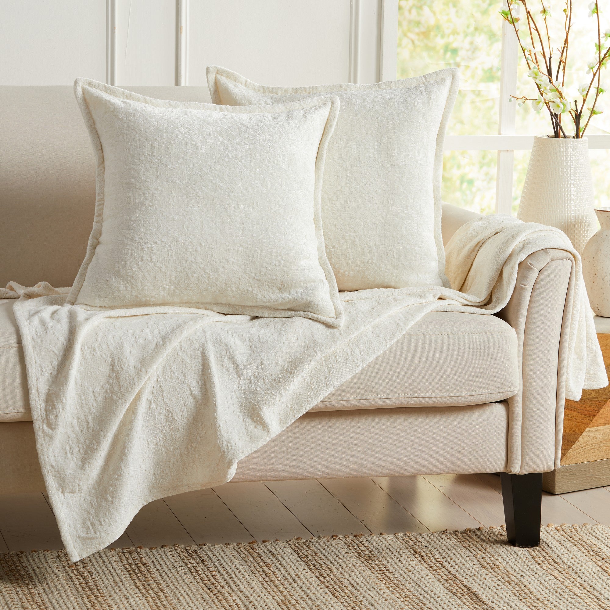 White chenille jacquard decorative pillow covers set of 2 on an accent chair, soft textured throw pillow covers for living room, bedroom, farmhouse, and modern home decor