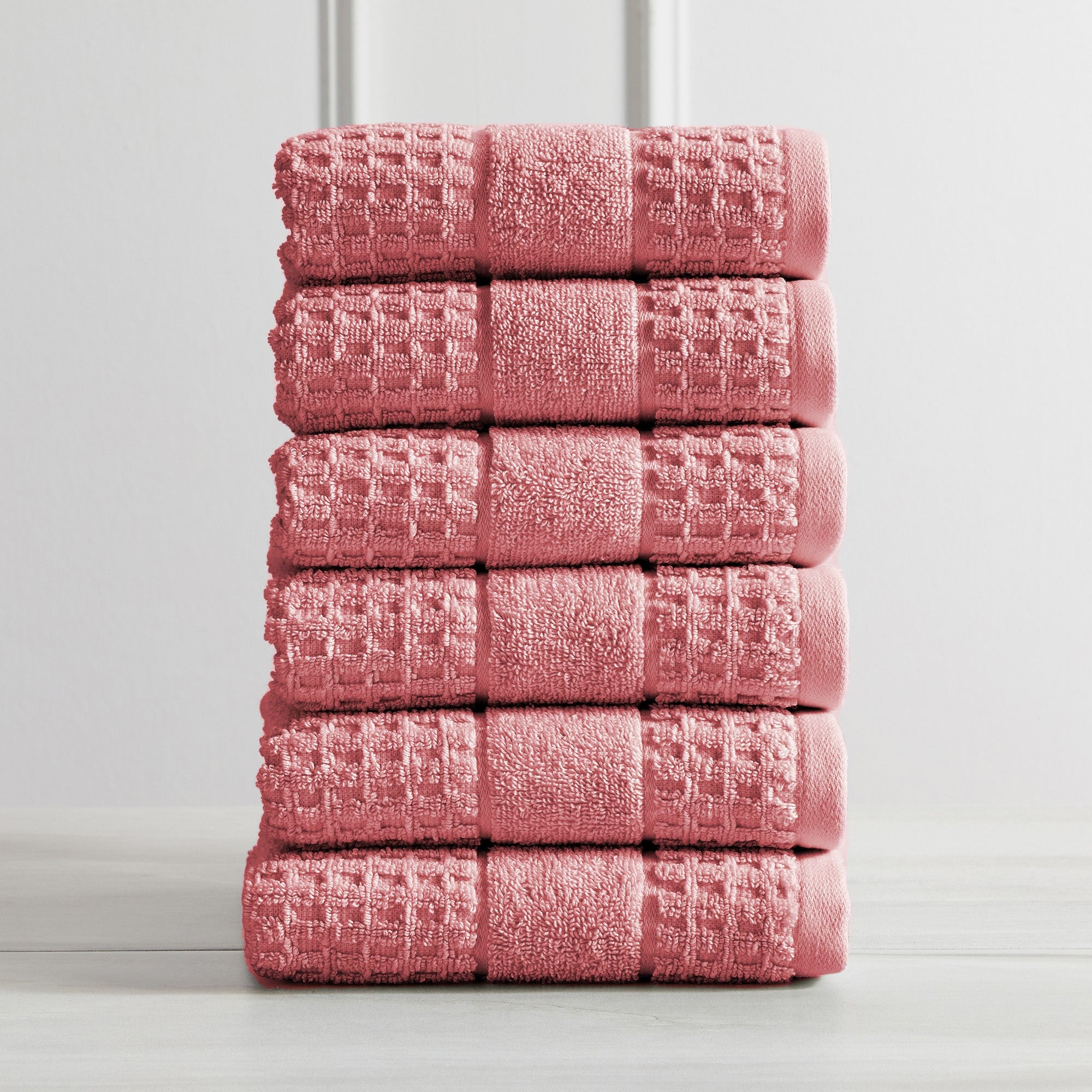 Harper Collection Waffle Textured Bath Towels by Market & Place featuring premium 100% cotton construction with a stylish waffle weave texture. Available in multiple colors and set configurations, including bath towels, hand towels, and washcloths, shown folded, stacked, and styled to highlight their soft, plush, and highly absorbent design.