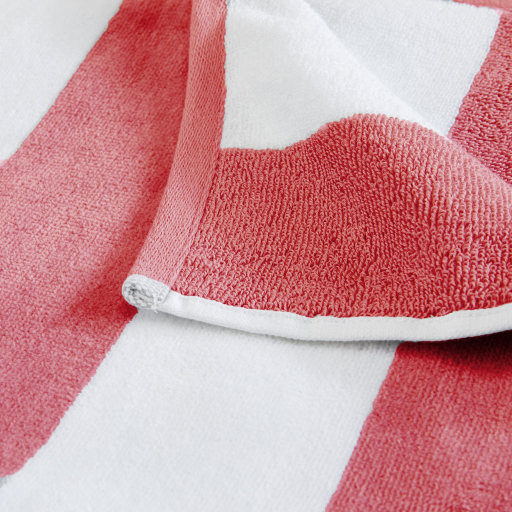 Marina Collection cotton cabana stripe beach towels in assorted colors and sizes, featuring classic striped designs and soft, absorbent 100% cotton velour construction, shown folded, stacked, and styled for poolside and beach use.