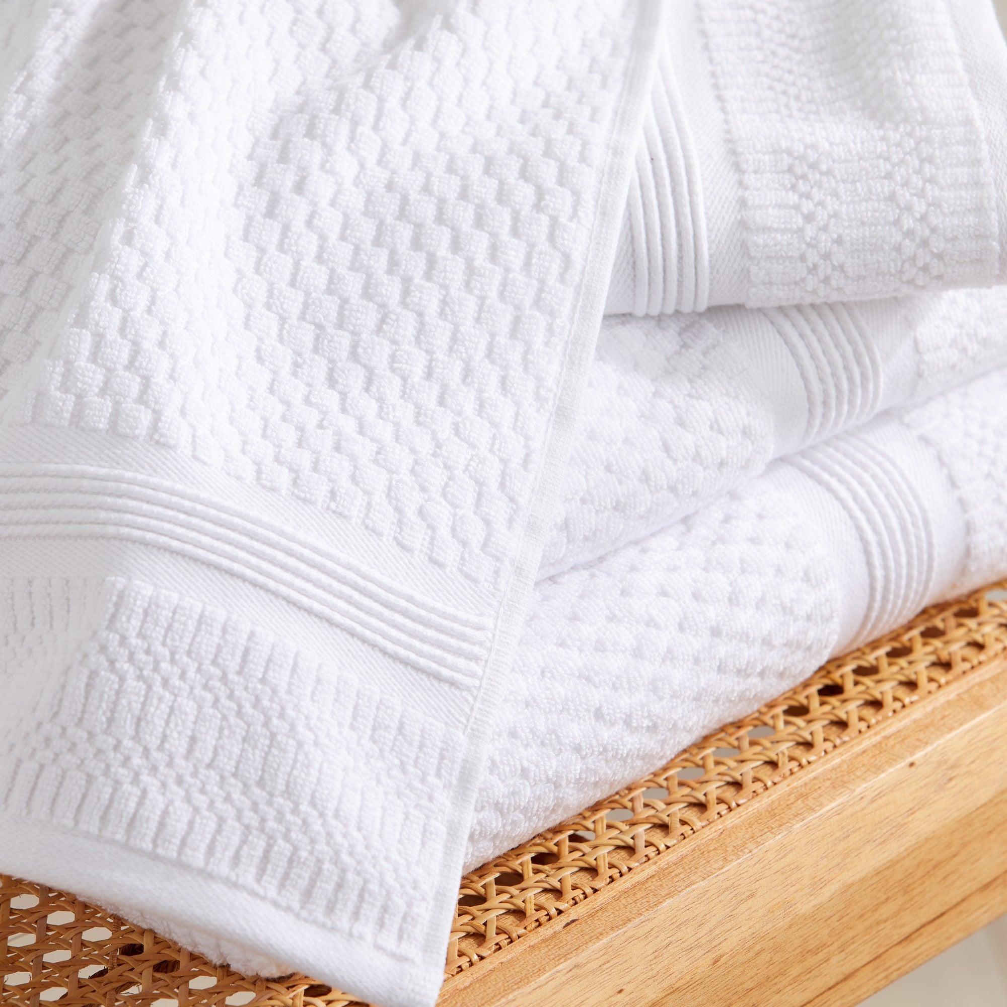 Close-up of white waffle weave cotton bath towels