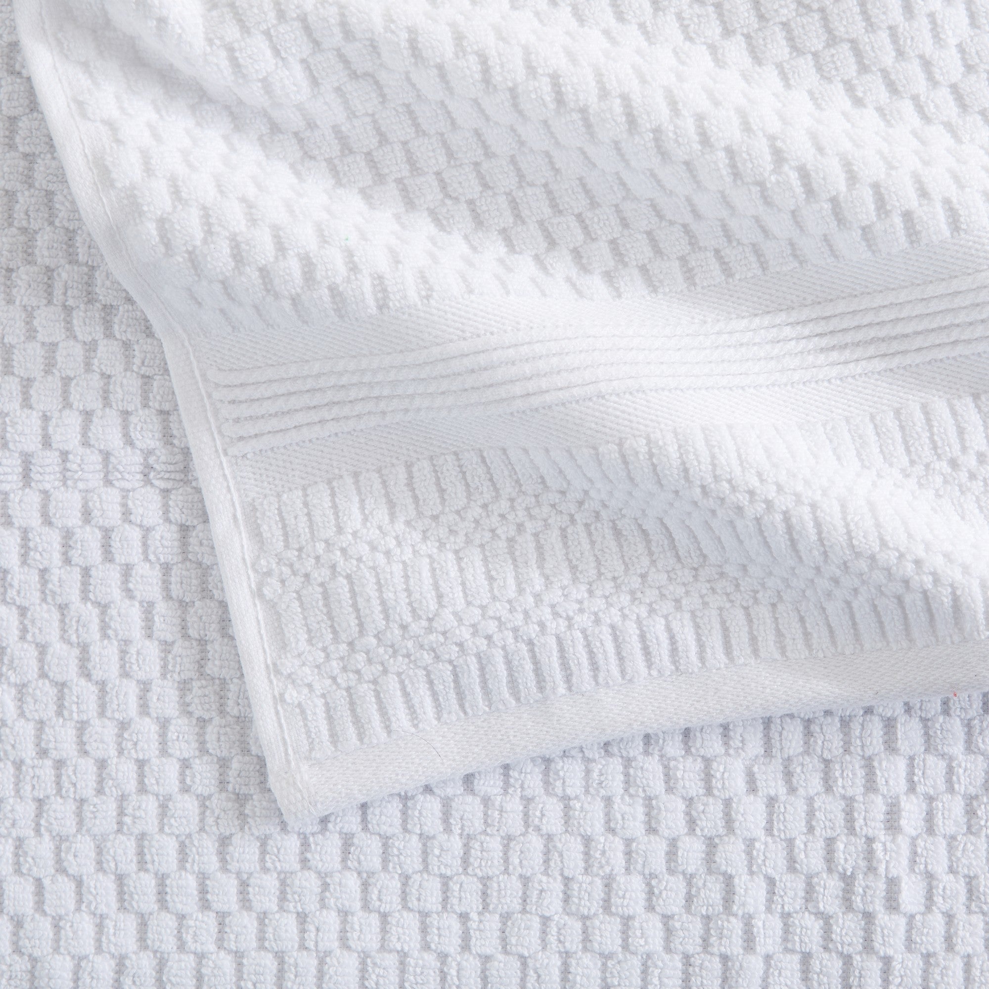 Close-up of white waffle weave cotton bath towel texture