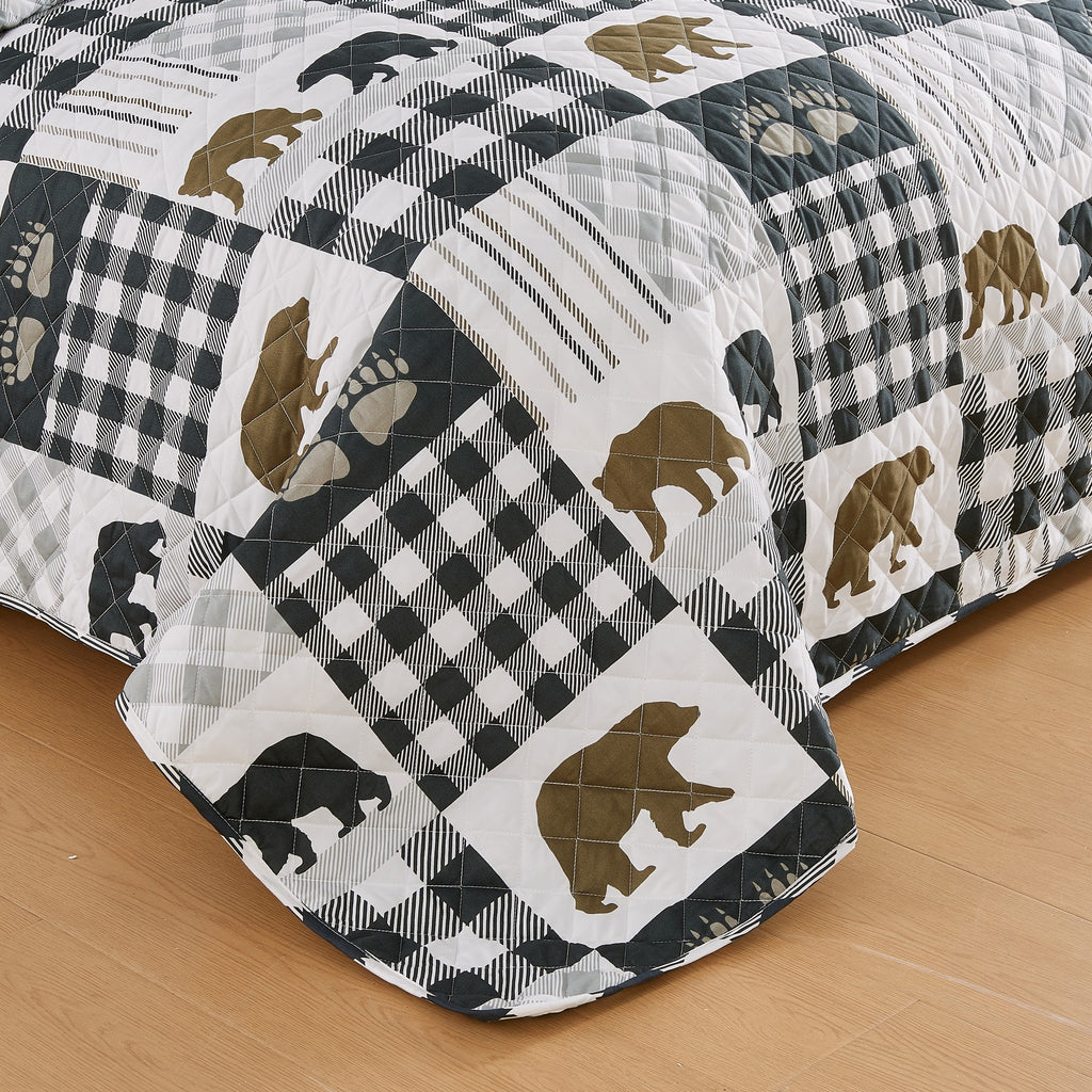 Orson Collection Lodge Quilt Set by Market & Place featuring soft microfiber construction and rustic lodge-inspired patchwork designs with plaid patterns and wildlife motifs. Coordinating shams and detailed fabric close-ups are shown in cozy bedroom settings, highlighting the reversible design and year-round comfort.