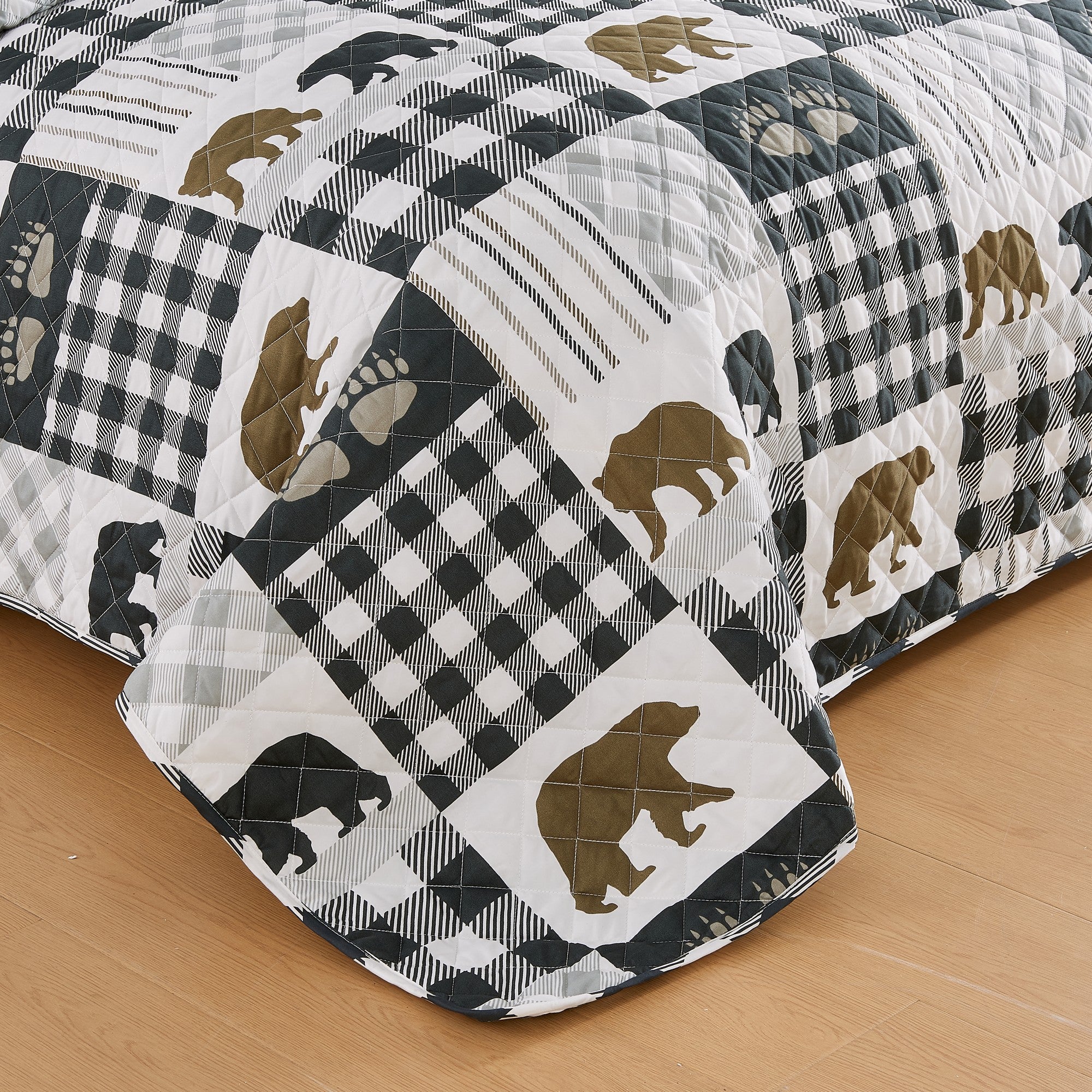 Orson Collection Lodge Quilt Set by Market & Place featuring soft microfiber construction and rustic lodge-inspired patchwork designs with plaid patterns and wildlife motifs. Coordinating shams and detailed fabric close-ups are shown in cozy bedroom settings, highlighting the reversible design and year-round comfort.