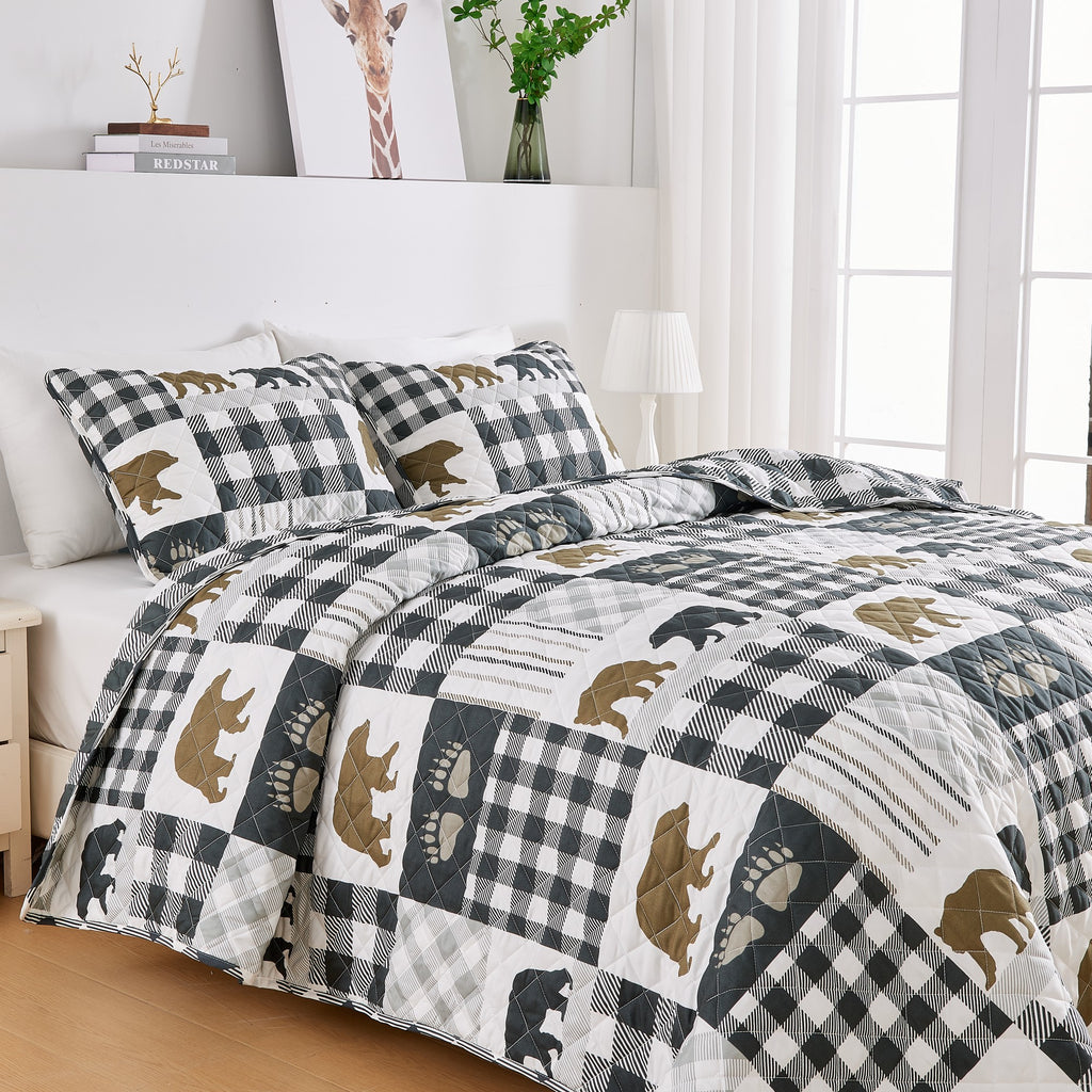 Orson Collection Lodge Quilt Set by Market & Place featuring soft microfiber construction and rustic lodge-inspired patchwork designs with plaid patterns and wildlife motifs. Coordinating shams and detailed fabric close-ups are shown in cozy bedroom settings, highlighting the reversible design and year-round comfort.