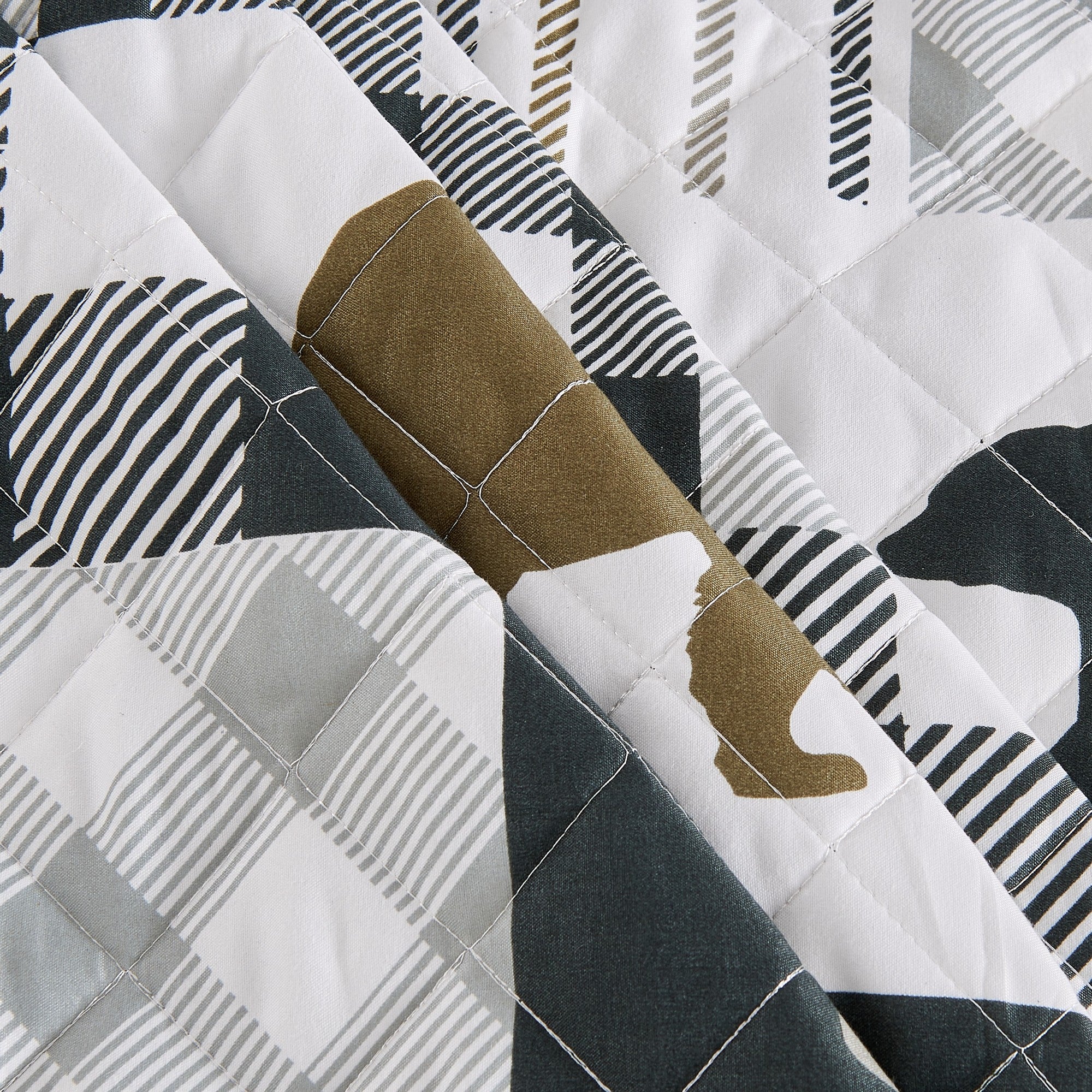 Orson Collection Lodge Quilt Set by Market & Place featuring soft microfiber construction and rustic lodge-inspired patchwork designs with plaid patterns and wildlife motifs. Coordinating shams and detailed fabric close-ups are shown in cozy bedroom settings, highlighting the reversible design and year-round comfort.