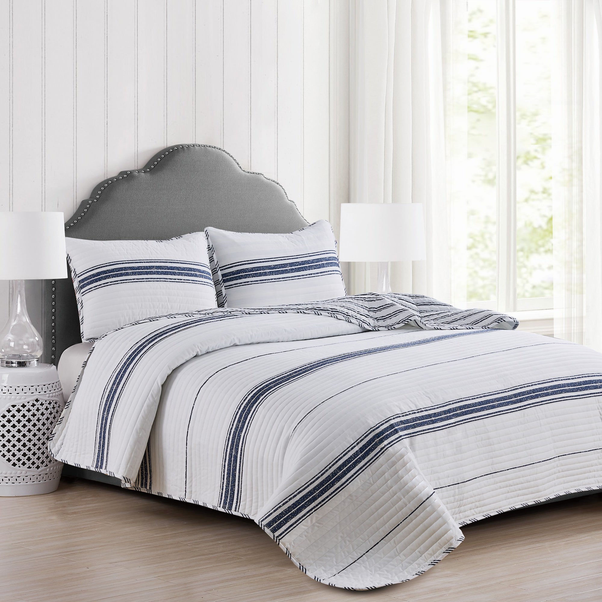 Harper Collection striped quilt set featuring navy blue and white horizontal stripes with matching pillow shams.