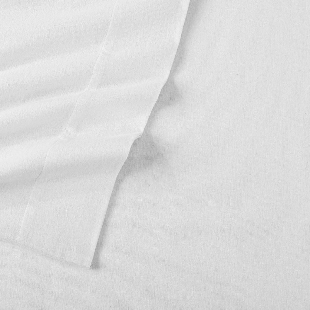 Chalet Collection Solid Flannel Sheet Set in assorted solid colors, featuring ultra-soft 100% Turkish cotton flannel bedding with coordinating pillowcases and fitted sheets, shown styled on beds and folded for detail views.