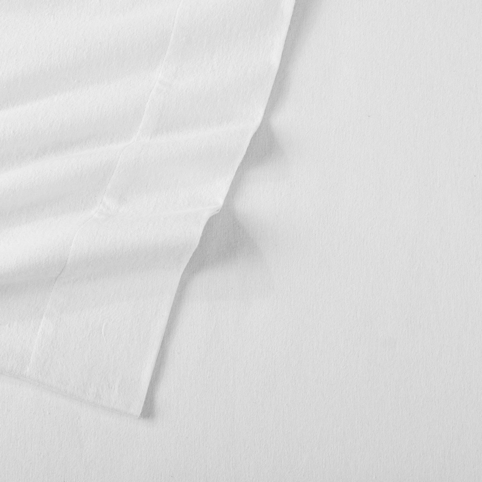 Chalet Collection Solid Flannel Sheet Set in assorted solid colors, featuring ultra-soft 100% Turkish cotton flannel bedding with coordinating pillowcases and fitted sheets, shown styled on beds and folded for detail views.