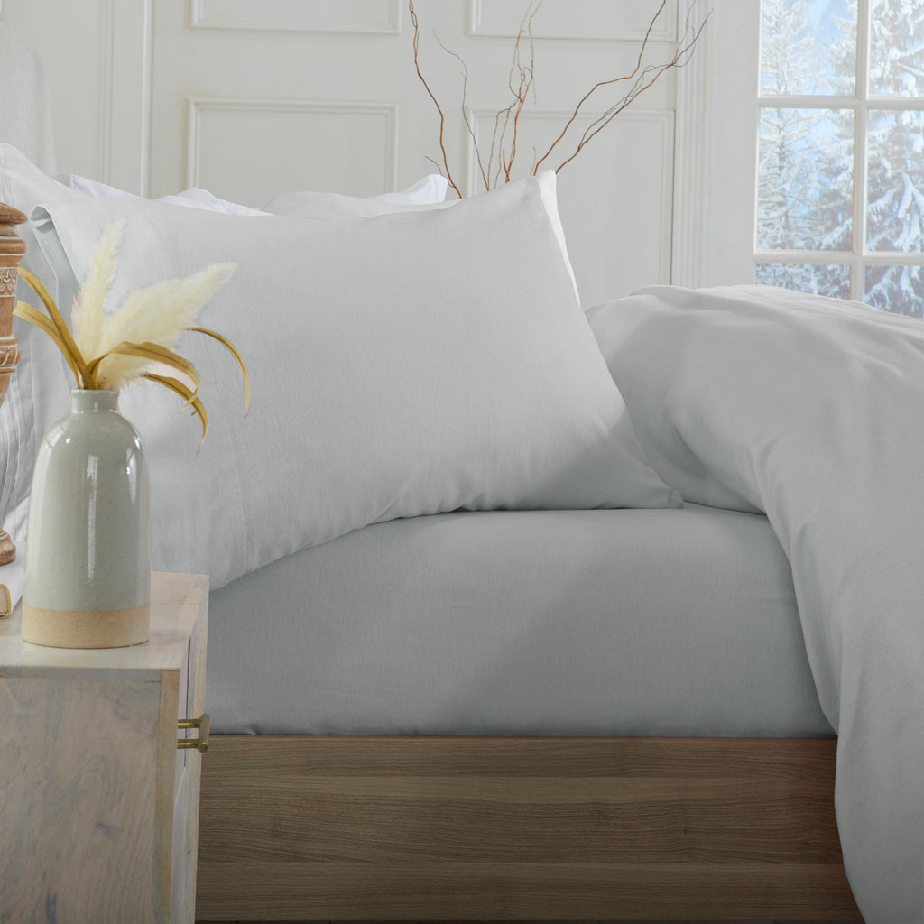 Chalet Collection Solid Flannel Sheet Set in assorted solid colors, featuring ultra-soft 100% Turkish cotton flannel bedding with coordinating pillowcases and fitted sheets, shown styled on beds and folded for detail views.